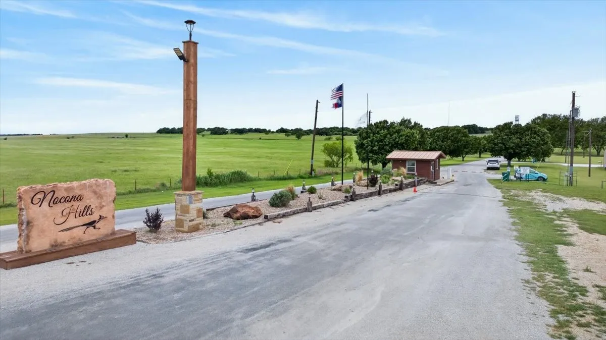 Entrance to community showing guard house and gate