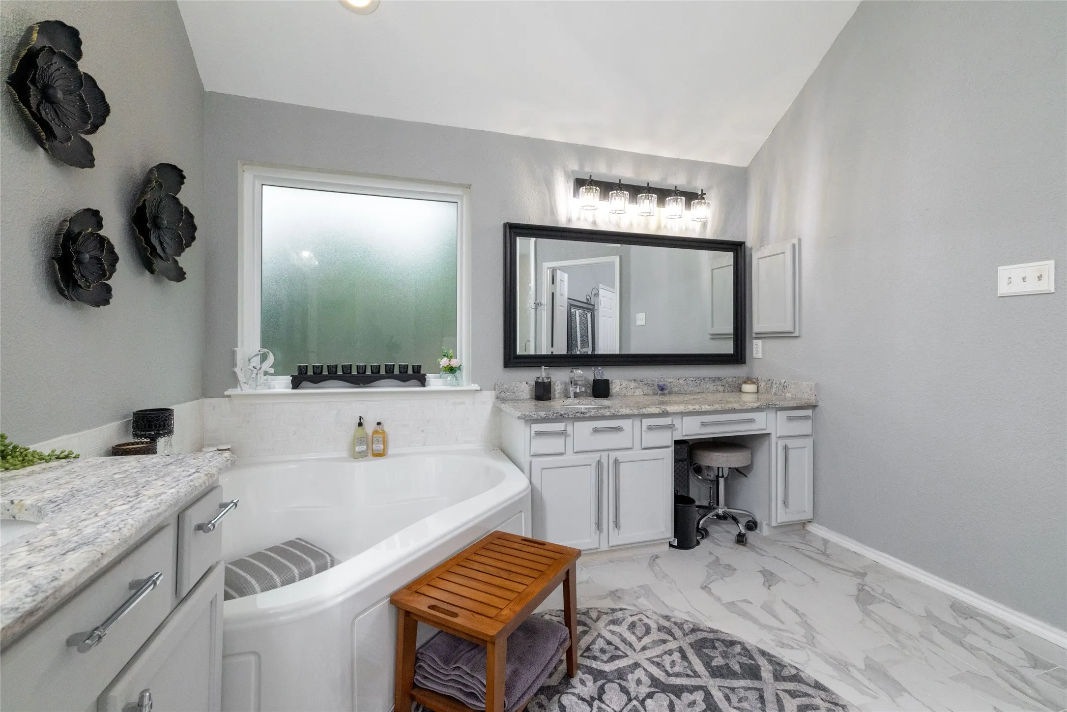 Soaking tub with a tiled surround and privacy window