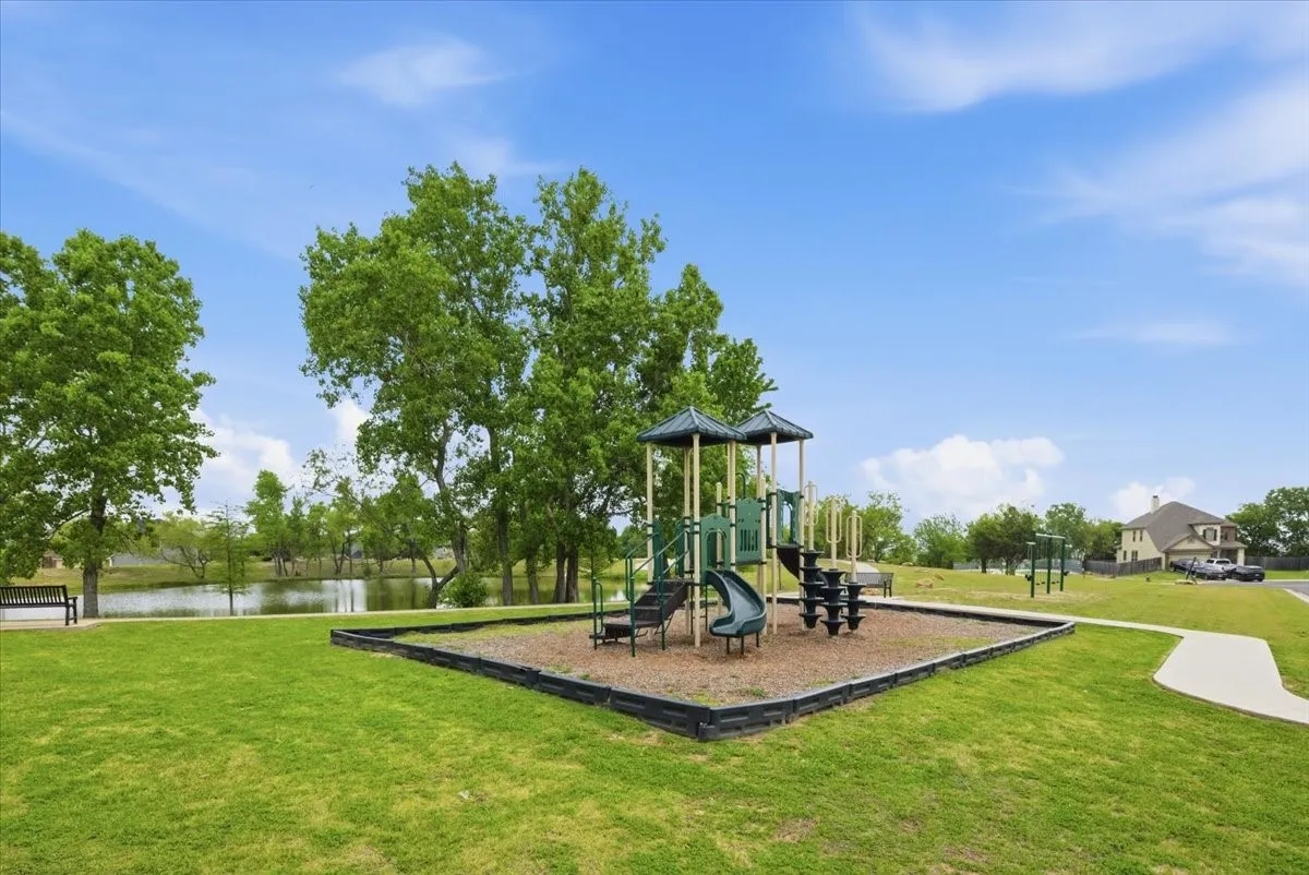 Community play area featuring a playground set and swing set