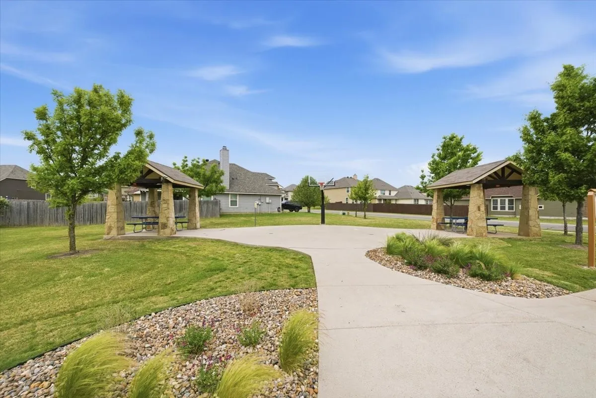 View of home's community with a picnic and gathering area