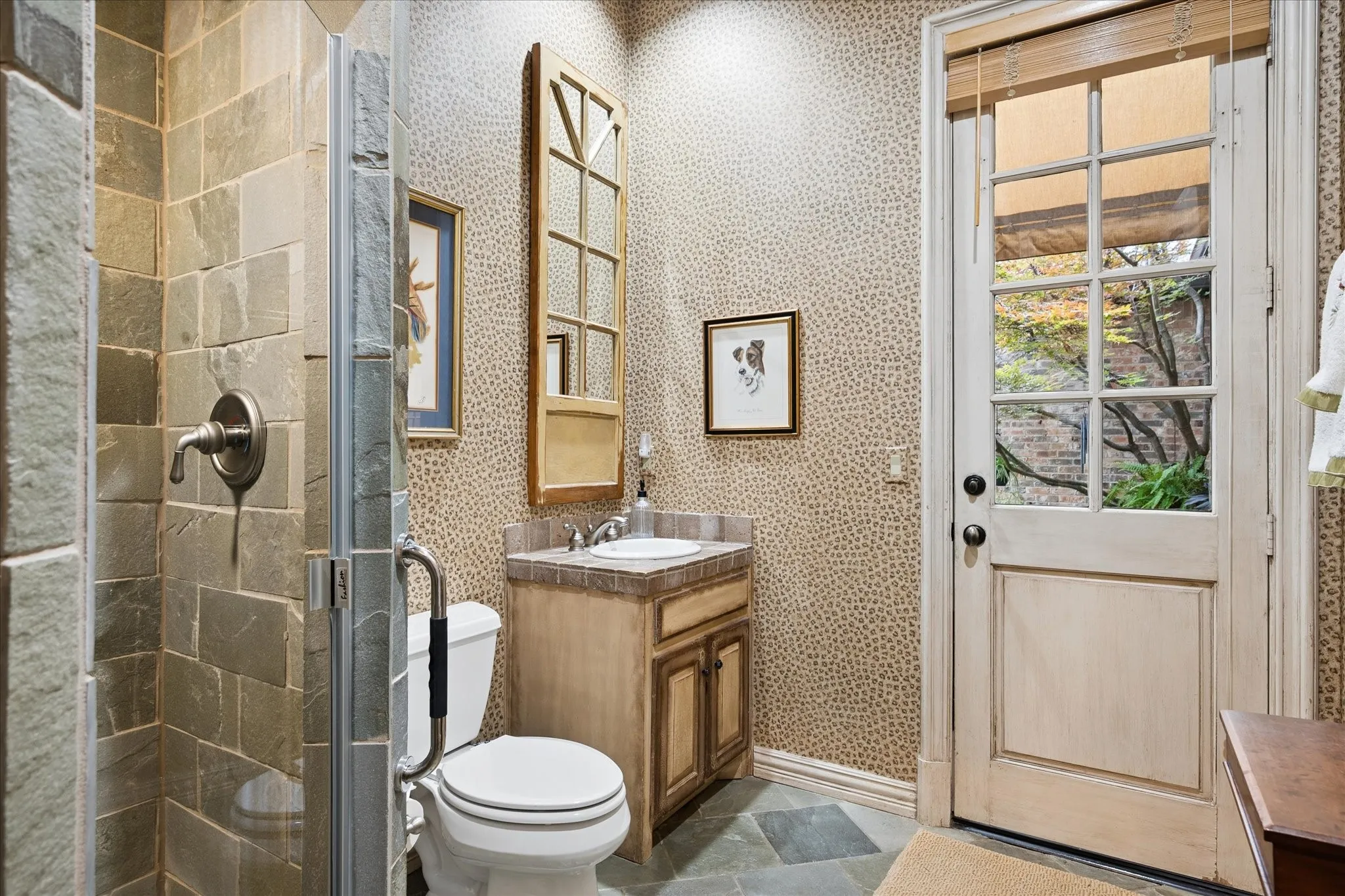 Full bath with door going to the pool area