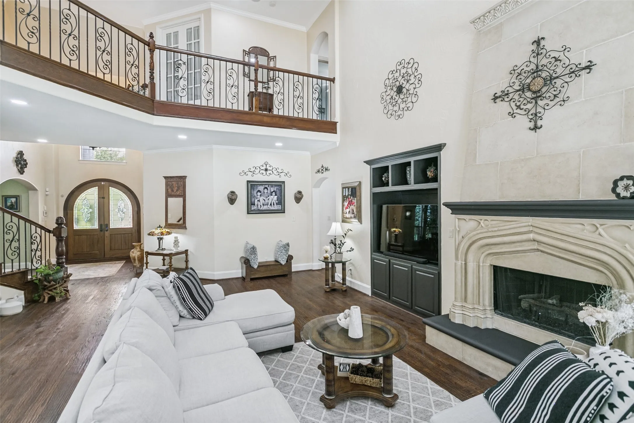 Great Room showcasing Stone Fireplace with Gas Logs and Second Floor Large Catwalk