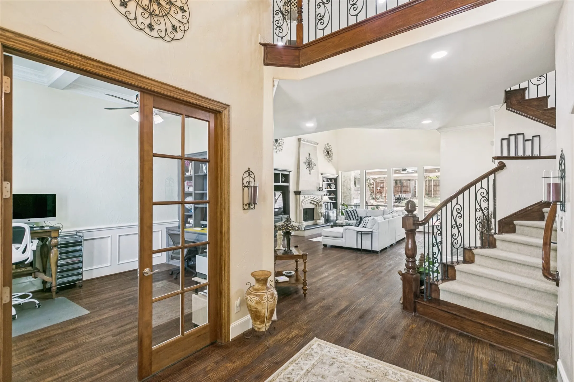 Entrance to Home with Custom Hand Nailed HardWood Floors and Multi-Staircase home