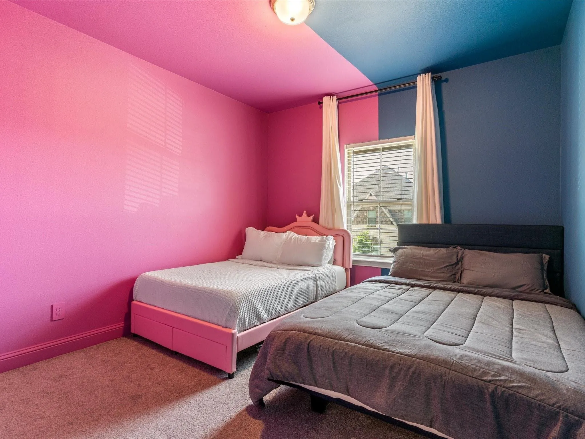 Room featuring dual-toned walls and ceiling, carpet flooring, a window with blinds, and white curtains