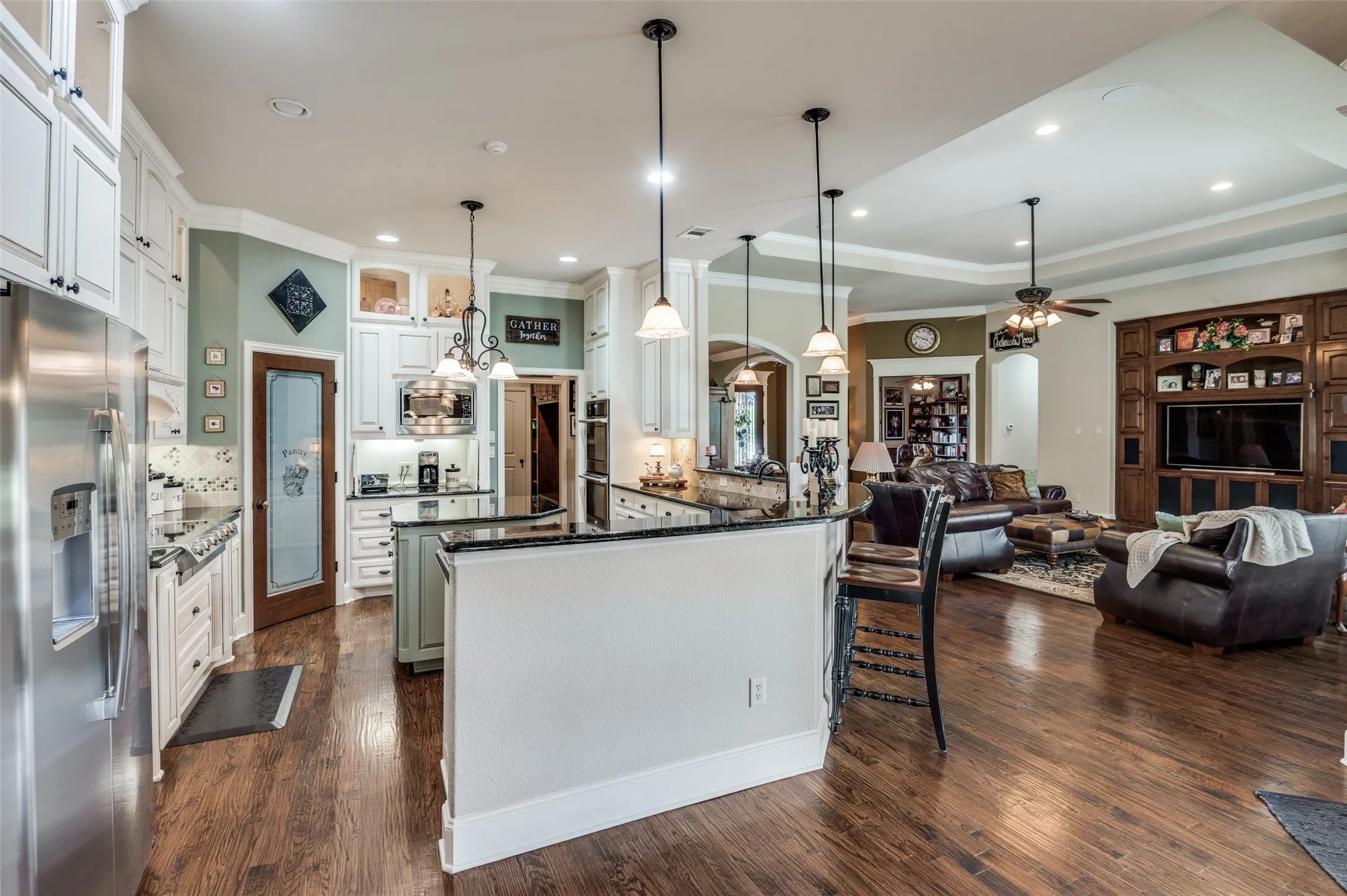 Open to living and breakfast room. Breakfast bar, pendant lighting, recessed lighting, wide baseboards!