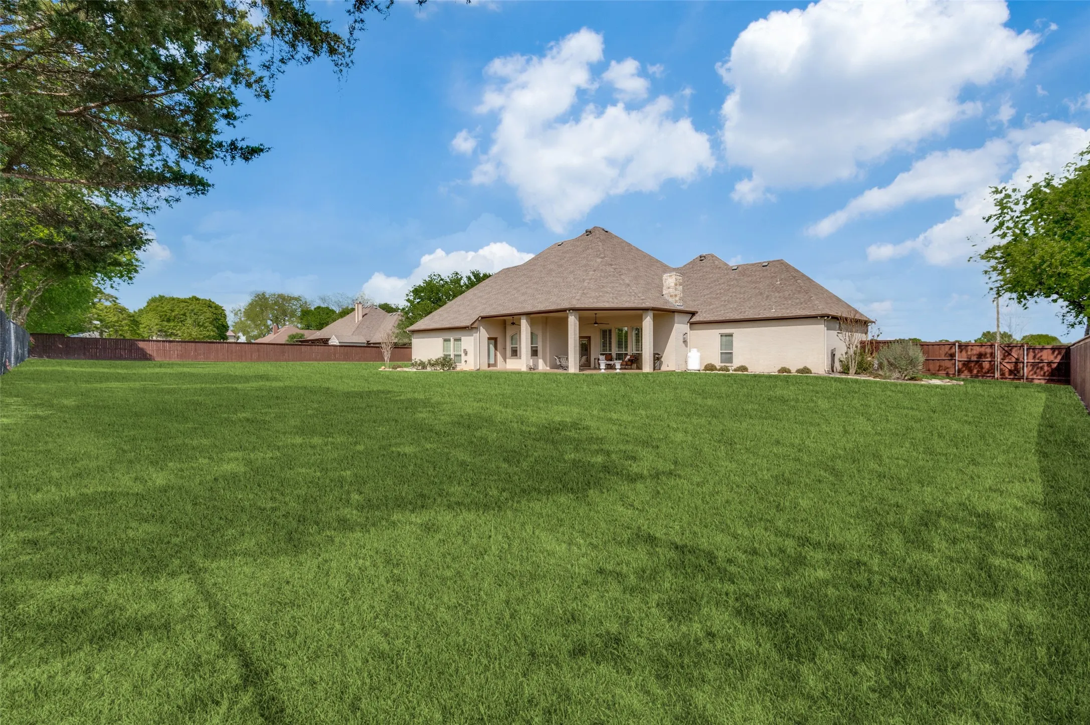 Another backyard view! Lots of space for your dream backyard!