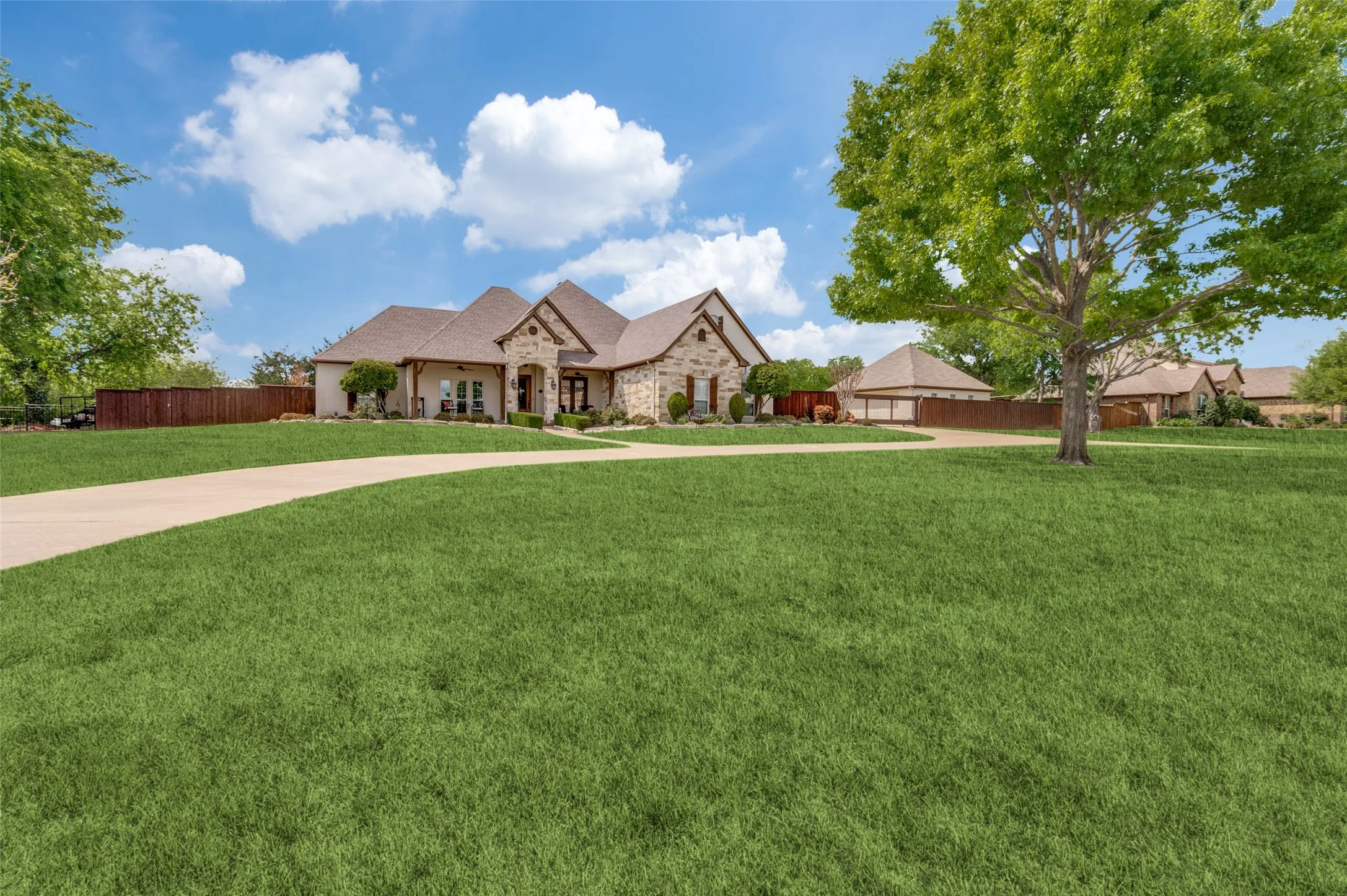 Circle drive for lots of extra parking.  No HOA! Close to Midlothian and Waxahachie! Gated entry to four car garage and workshop!  Lots of great executive home features!