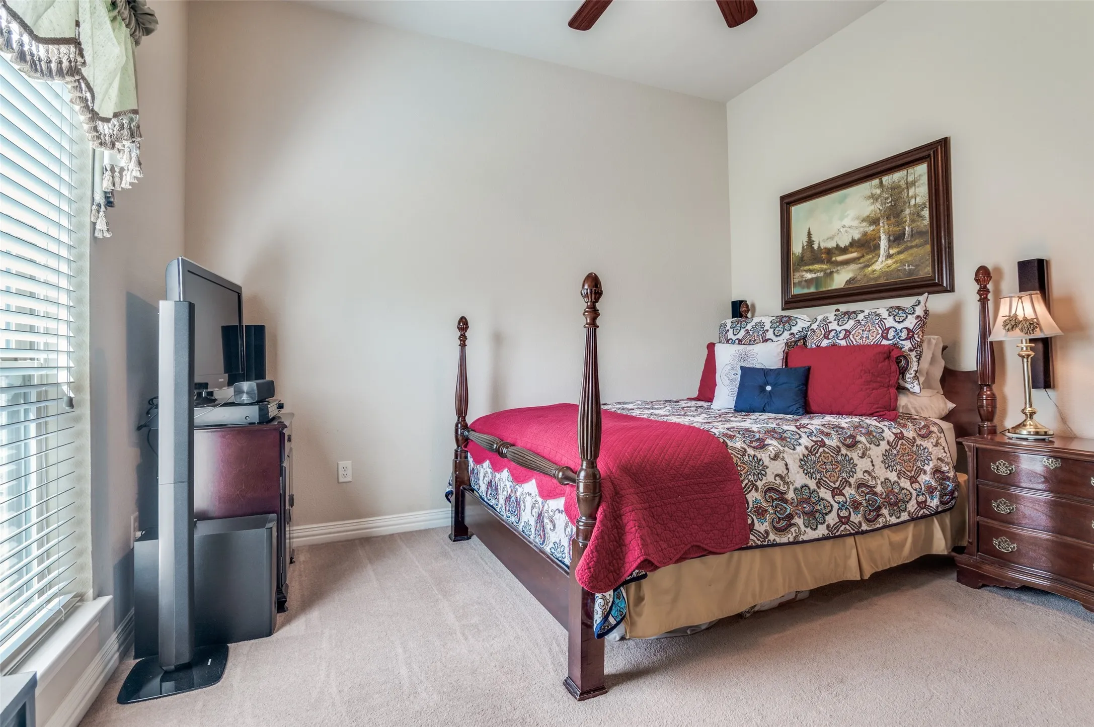 Secondary bedroom with private vanity and back views.