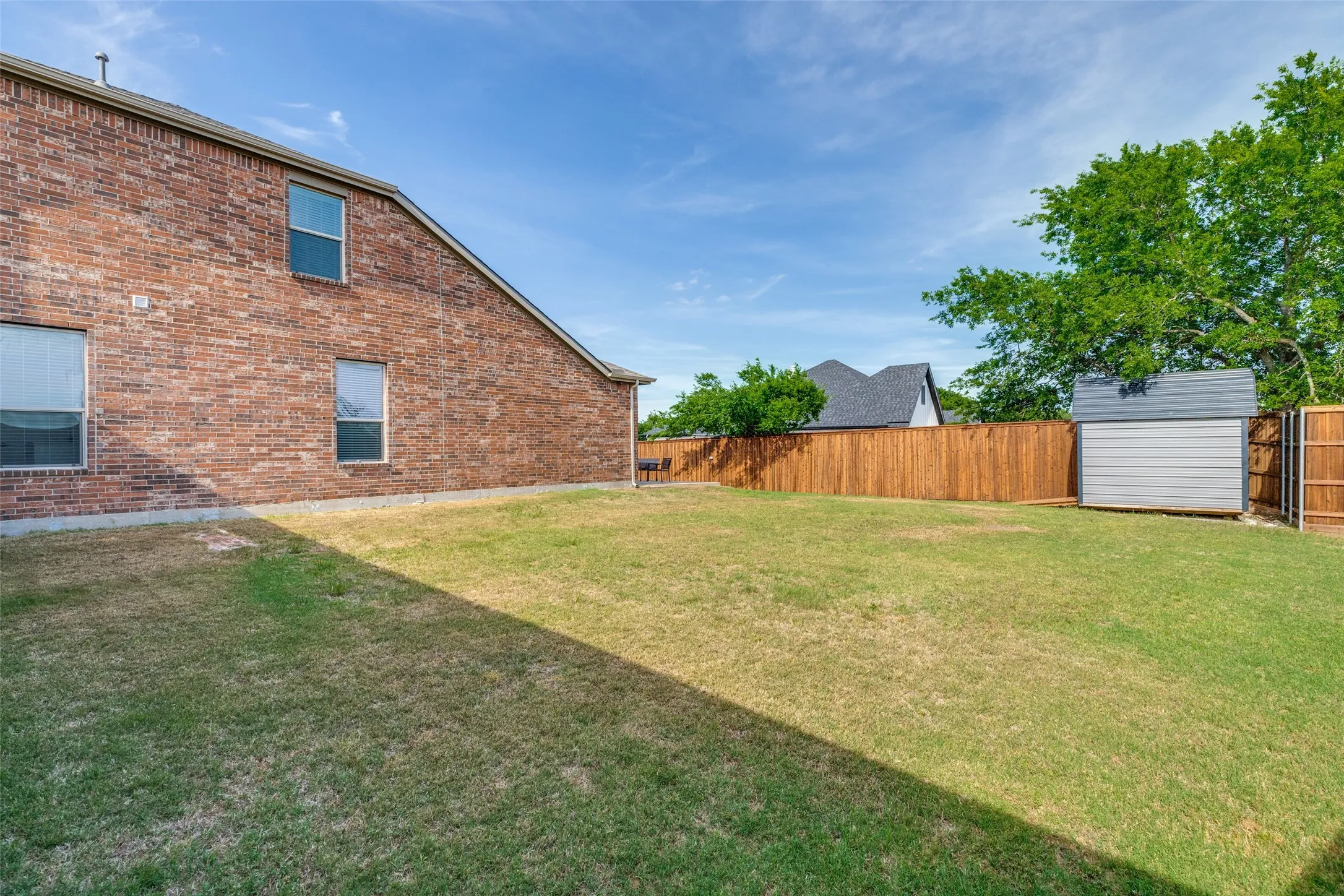 Huge side yard for any play, hobbies or sports.