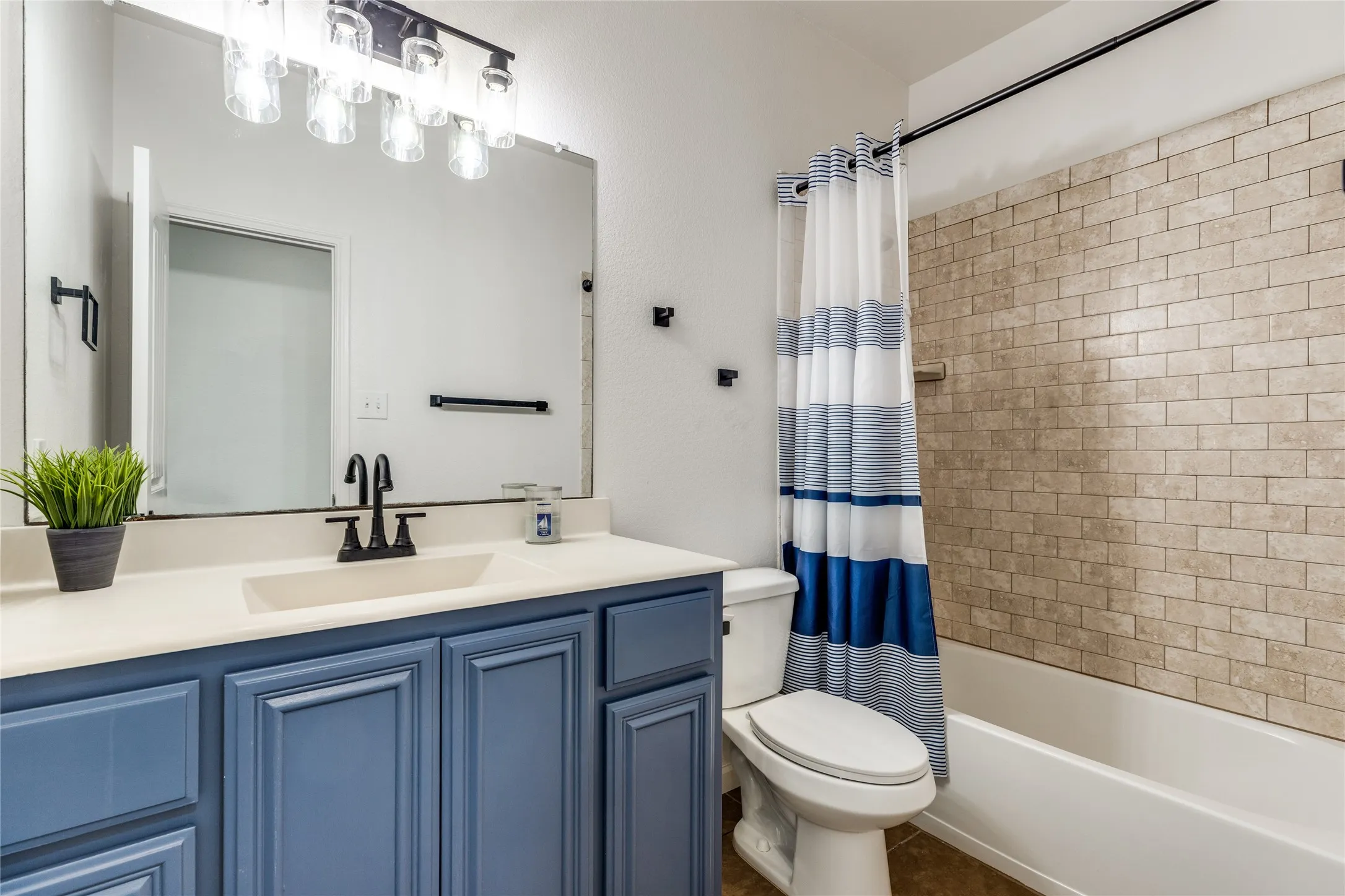 Upstairs full bath joins the flex space and bedroom.