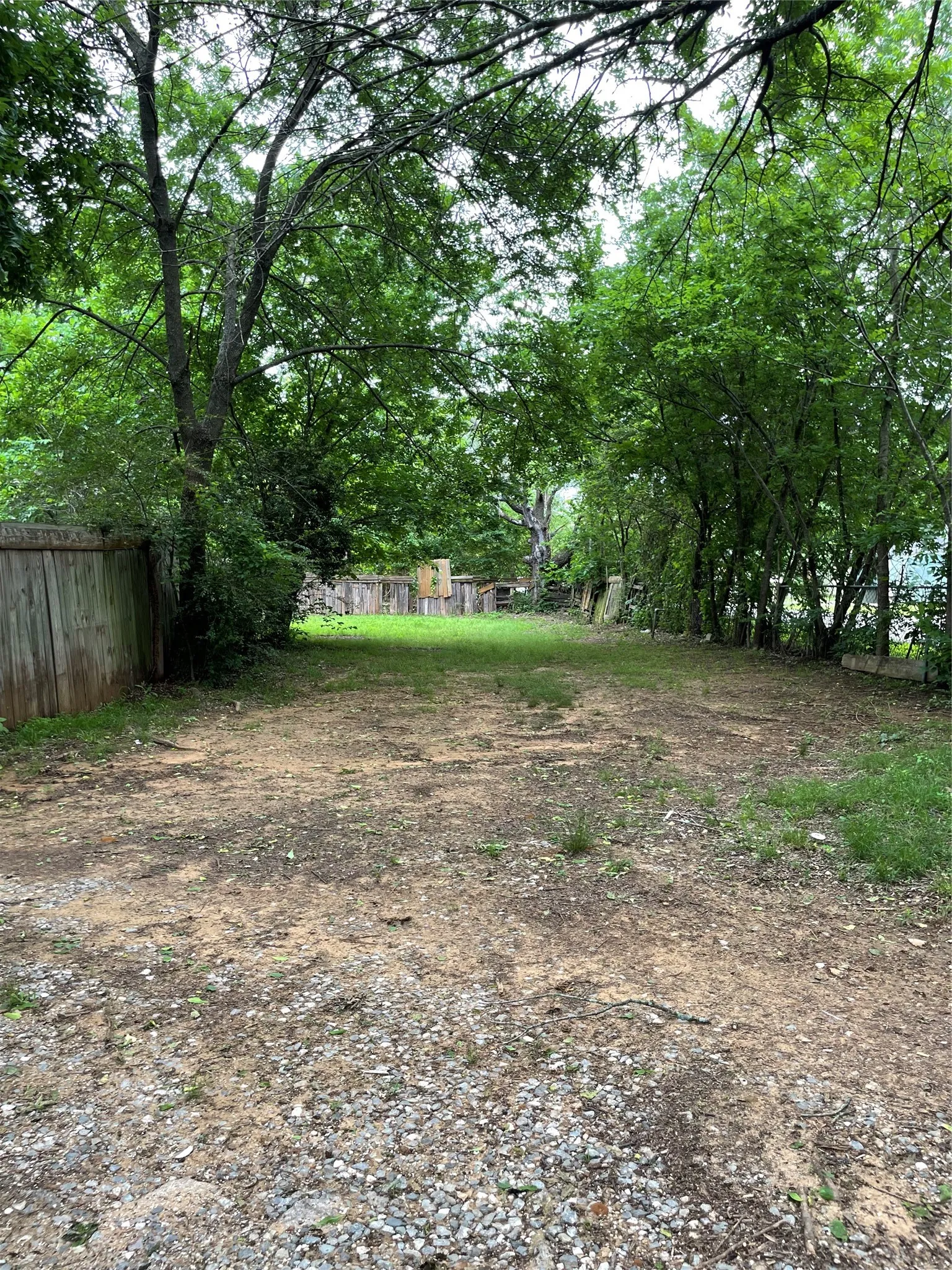 Spacious lot featuring mature trees providing natural canopy