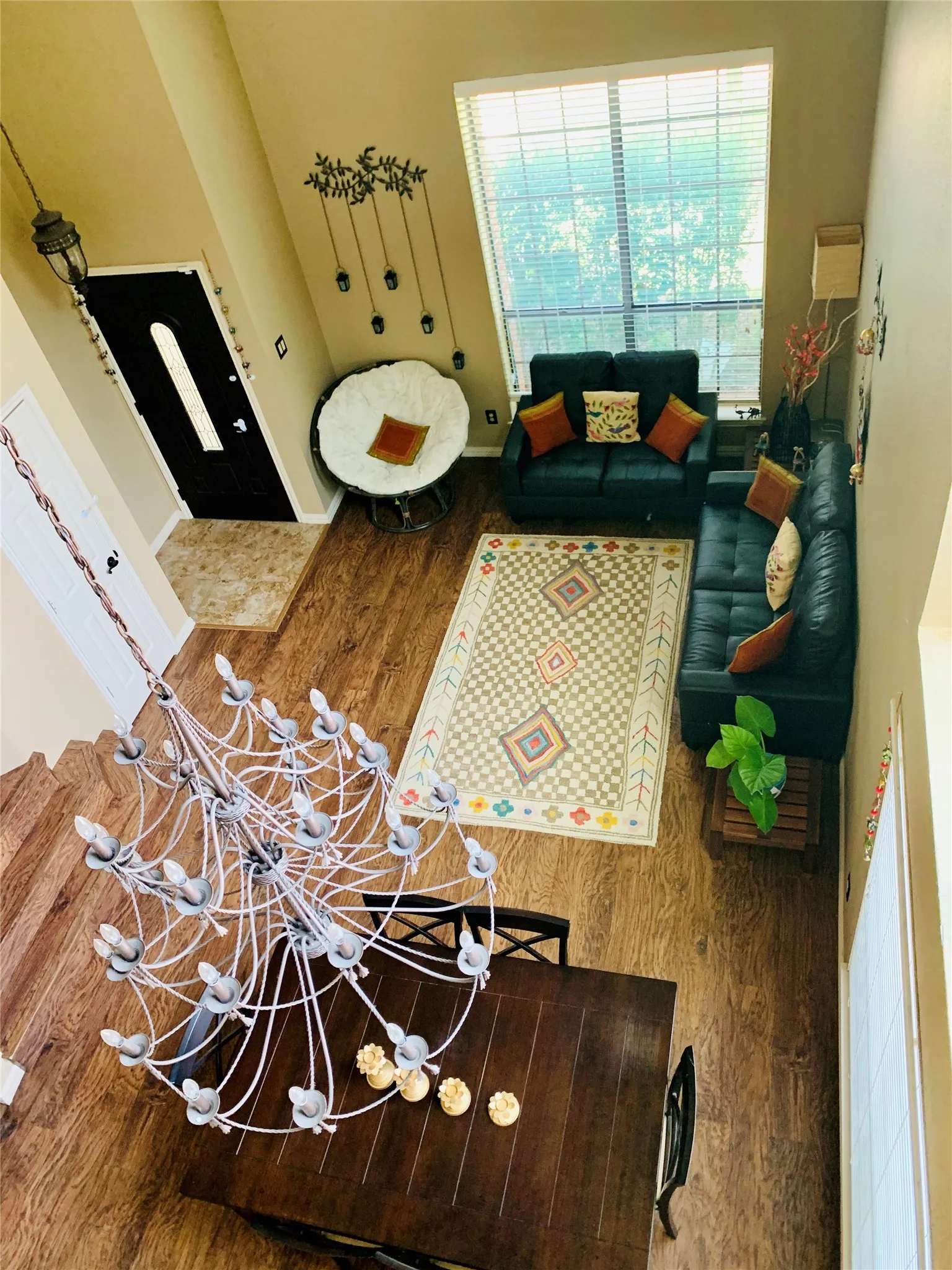 Two-story living area with wood-finish flooring throughout