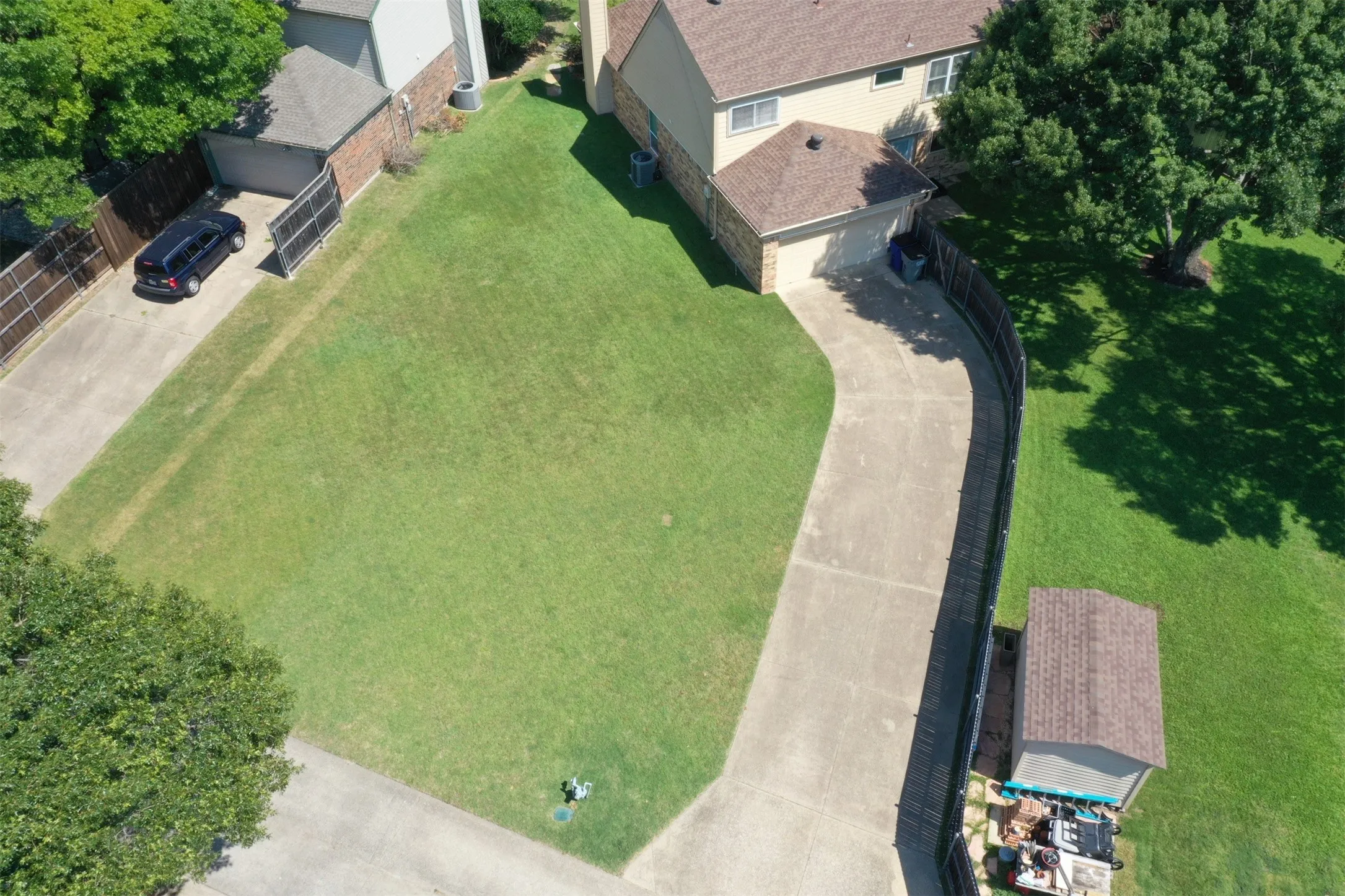 Addtional Expansive grassy yard.  Left side grass show property line.