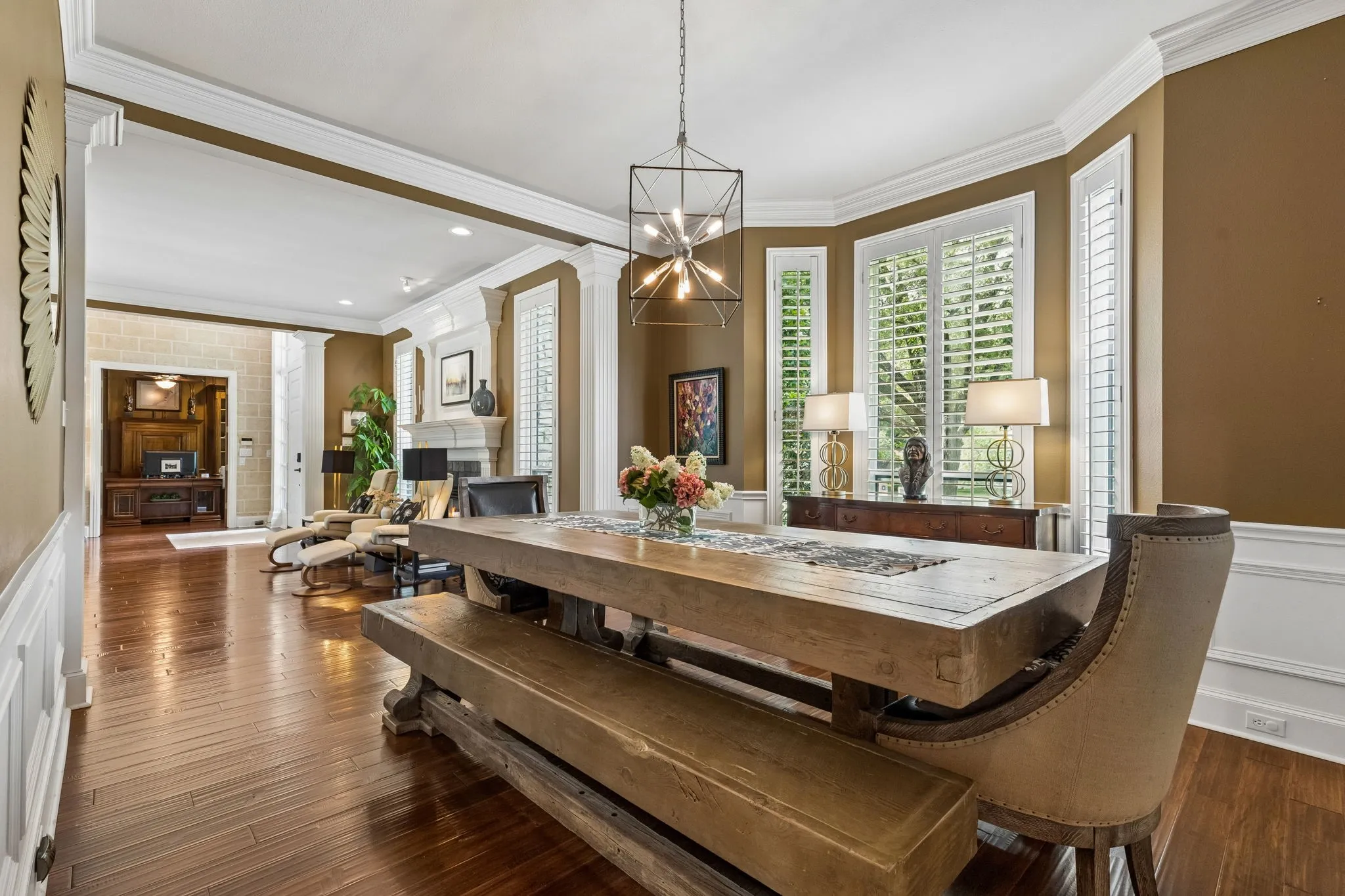 Formal living with fireplace and spacious formal dining perfectly suited for intimate gatherings or entertaining on a grand scale.