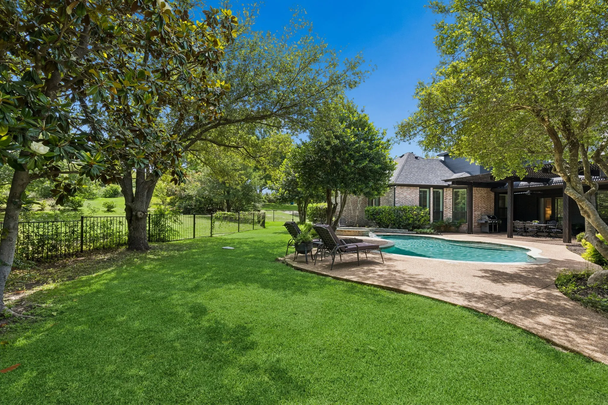 Prestigious Oakwood Estates offers a serene luxury setting just minutes from premier shopping, dining, and everyday conveniences.