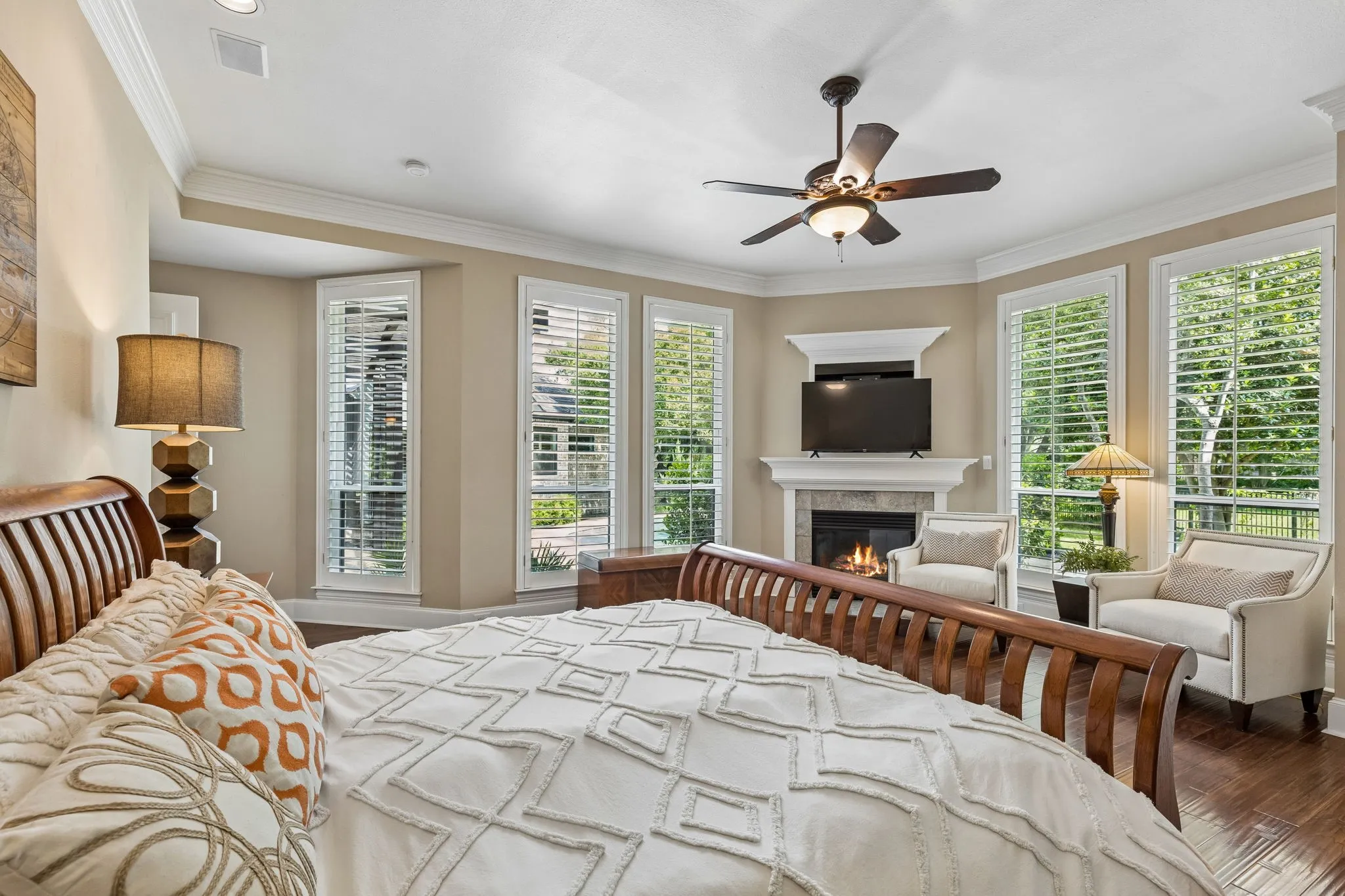 The oversized primary suite is tucked away with fireplace, sitting area, and expansive closet.