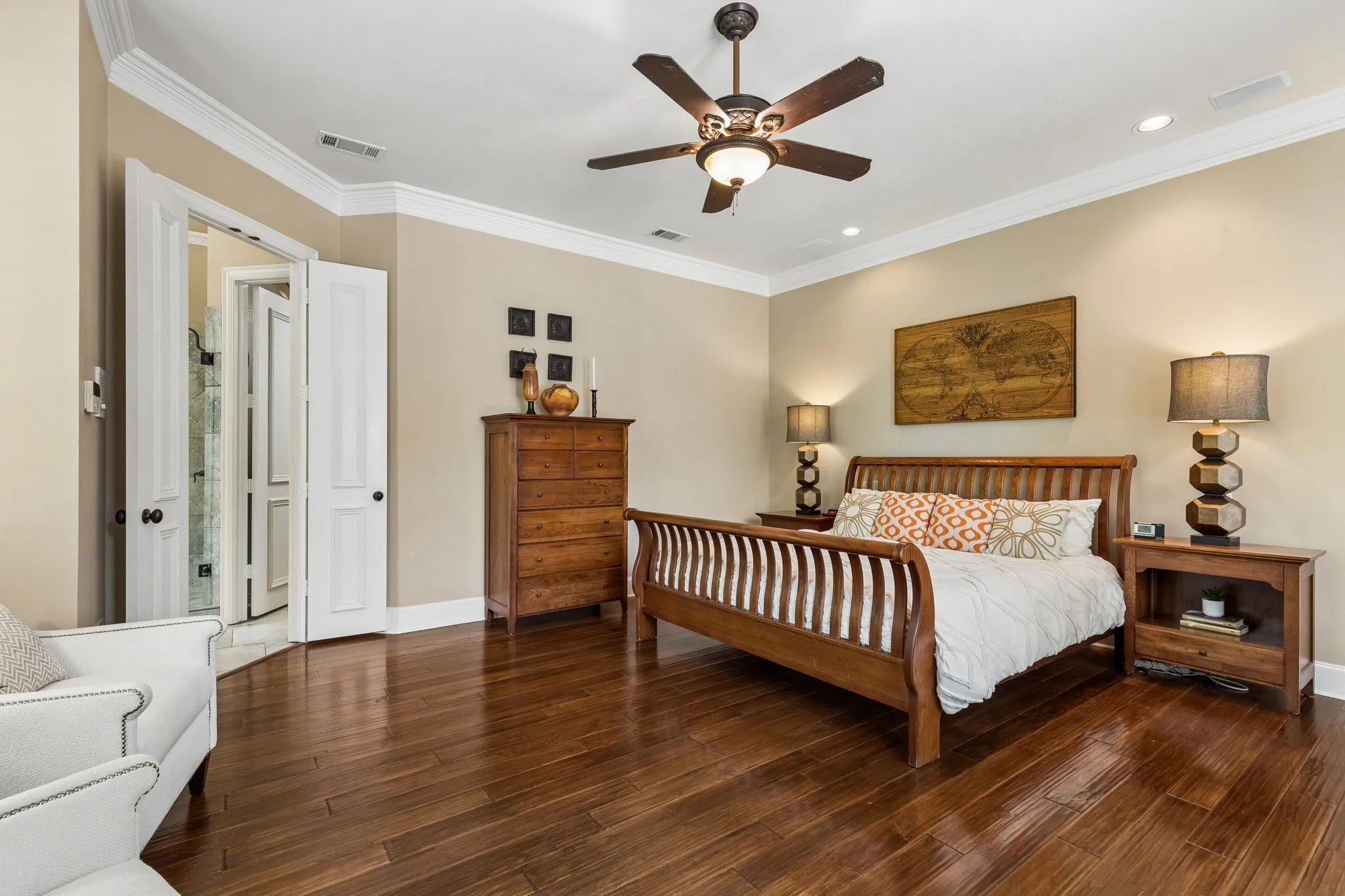 The oversized primary suite is tucked away with fireplace, sitting area, and expansive closet.