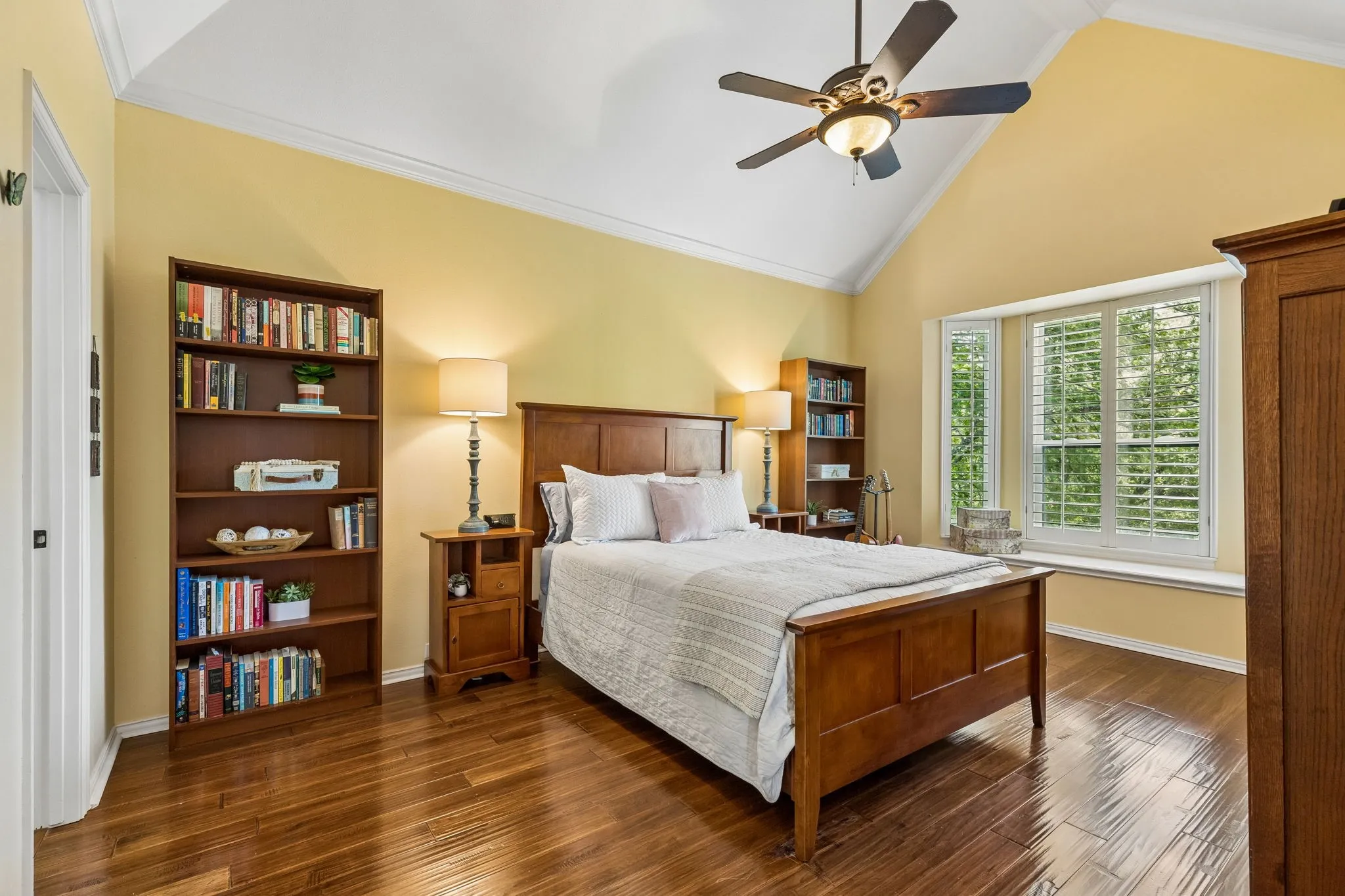 Second floor bedroom with vaulted ceilings, ensuite bath, and walk-in closet.