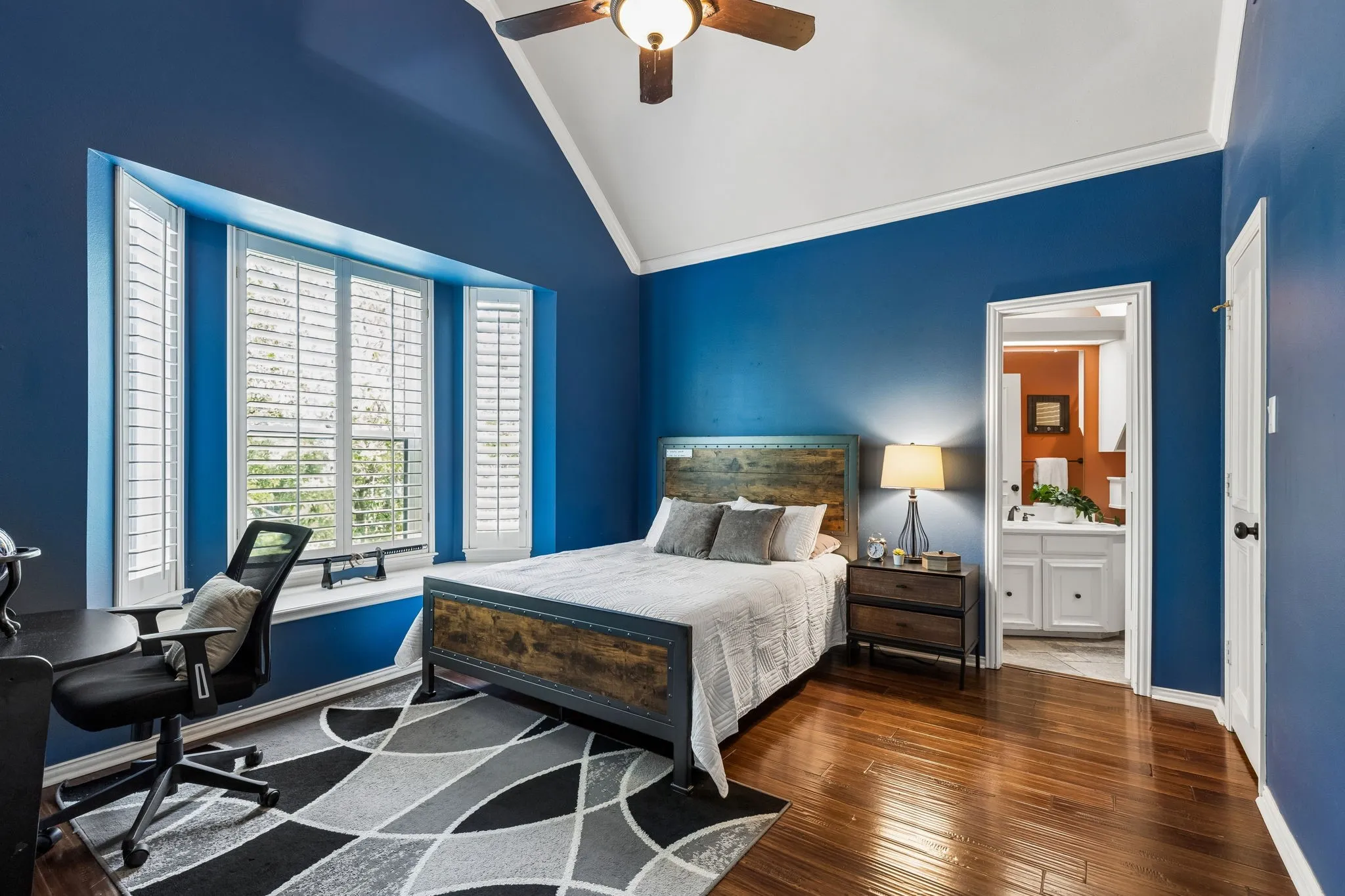 Second floor bedroom with vaulted ceilings, ensuite bath, and walk-in closet.