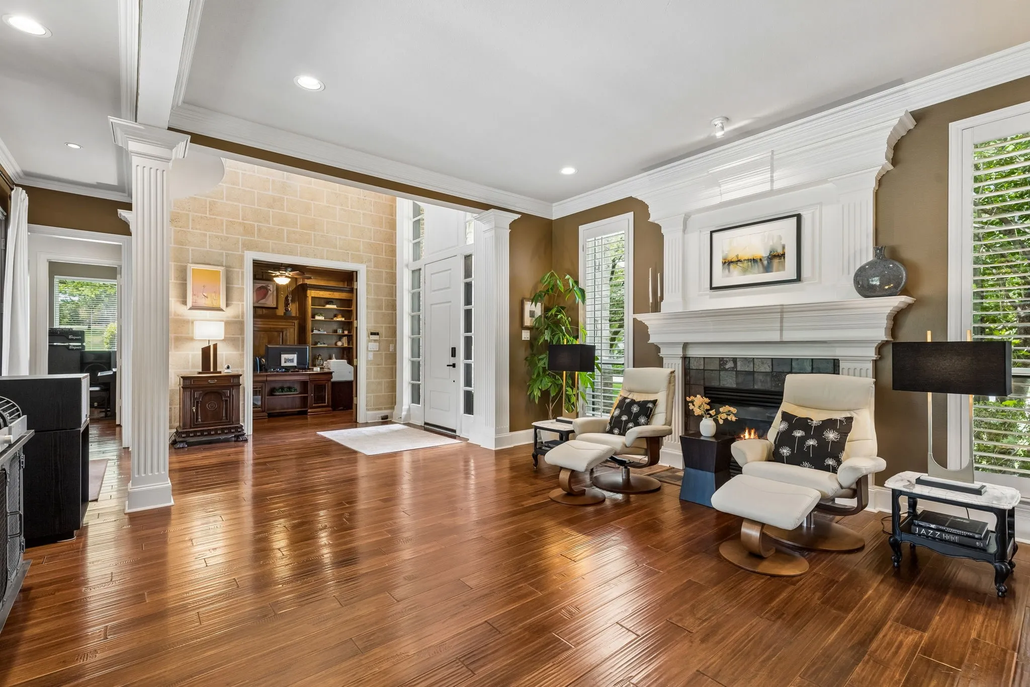 Formal living with fireplace and spacious formal dining perfectly suited for intimate gatherings or entertaining on a grand scale.