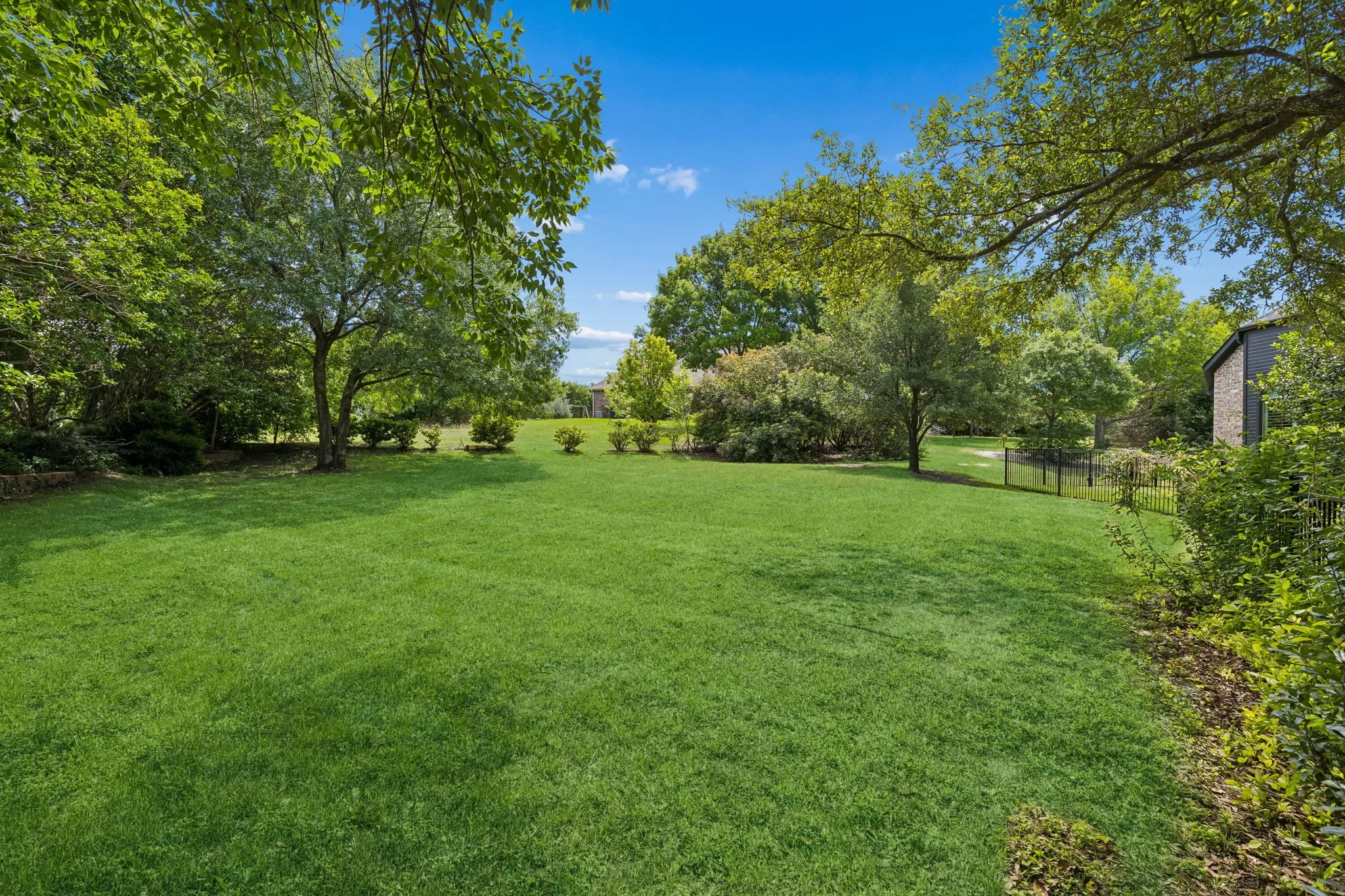 Gorgeous one-acre lot with lush landscaping, and mature trees surrounding the property for ultimate privacy.