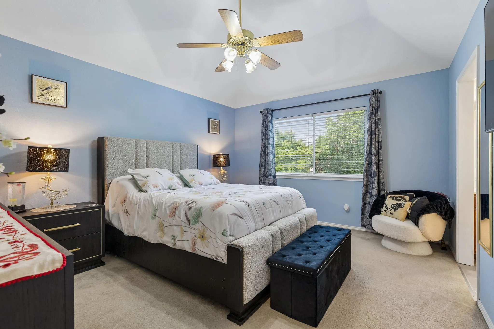 Spacious room featuring vaulted ceiling