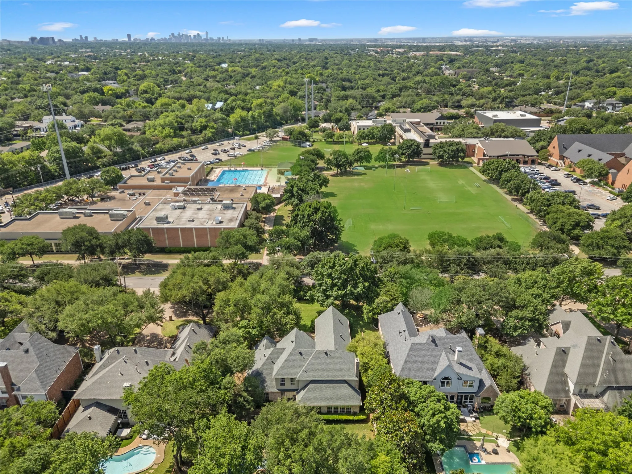 Perfectly positioned in one of Dallas’ most desirable and established neighborhoods, 4315 Northaven offers a rare combination of privacy, oversized lot space, and unbeatable convenience. Surrounded by mature trees and beautiful custom homes, this property feels like a peaceful retreat while remaining just minutes from the heart of the city.Situated near some of Dallas’ top private schools, including The Hockaday School, and close to major highways, shopping, dining, and entertainment, the location provides both luxury and everyday convenience. Just steps away, the nearby YMCA, sports fields, parks, and open green spaces create an active lifestyle that is hard to find in central Dallas.The oversized lot is a standout feature in the neighborhood, offering exceptional backyard space, mature landscaping, and a resort-style setting with pool, patio, and multiple outdoor entertaining areas. From the aerial views, you can truly appreciate the privacy created by the lush tree canopy and the expansive lot size