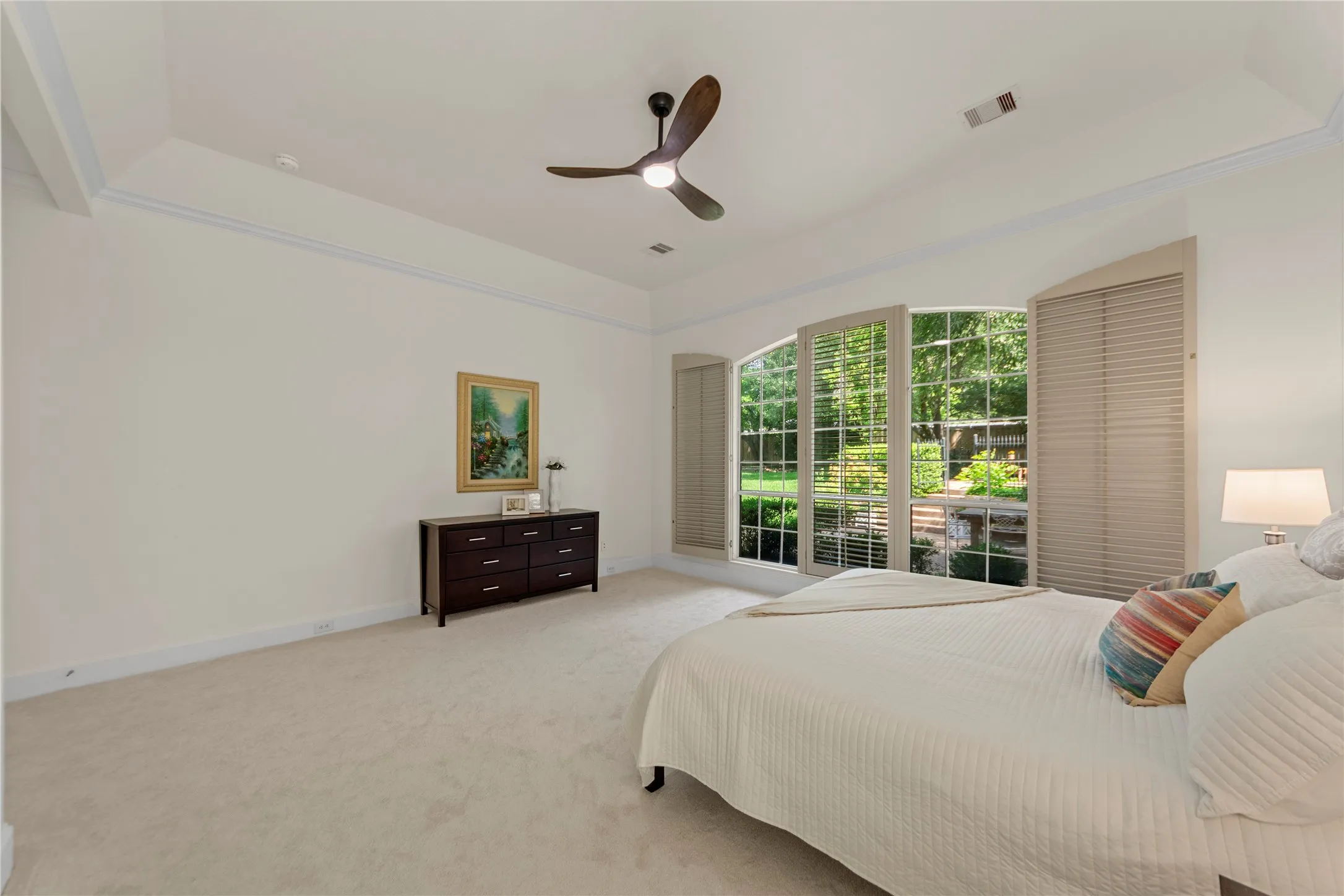 The spacious grand primary suite offers a peaceful retreat with soaring ceilings, abundant natural light, and a beautiful sitting area overlooking the lush backyard and pool. Designed for comfort and relaxation, the oversized bedroom feels bright, airy, and private.The completely updated spa-inspired primary bath showcases new quartz countertops, elegant new tile work, a stunning oversized walk-in shower, and a luxurious new freestanding soaking tub. Dual vanities, modern finishes, fresh designer paint, and thoughtfully selected fixtures create a clean, timeless look with a true resort-style feel. A perfect blend of elegance, comfort, and everyday luxury.