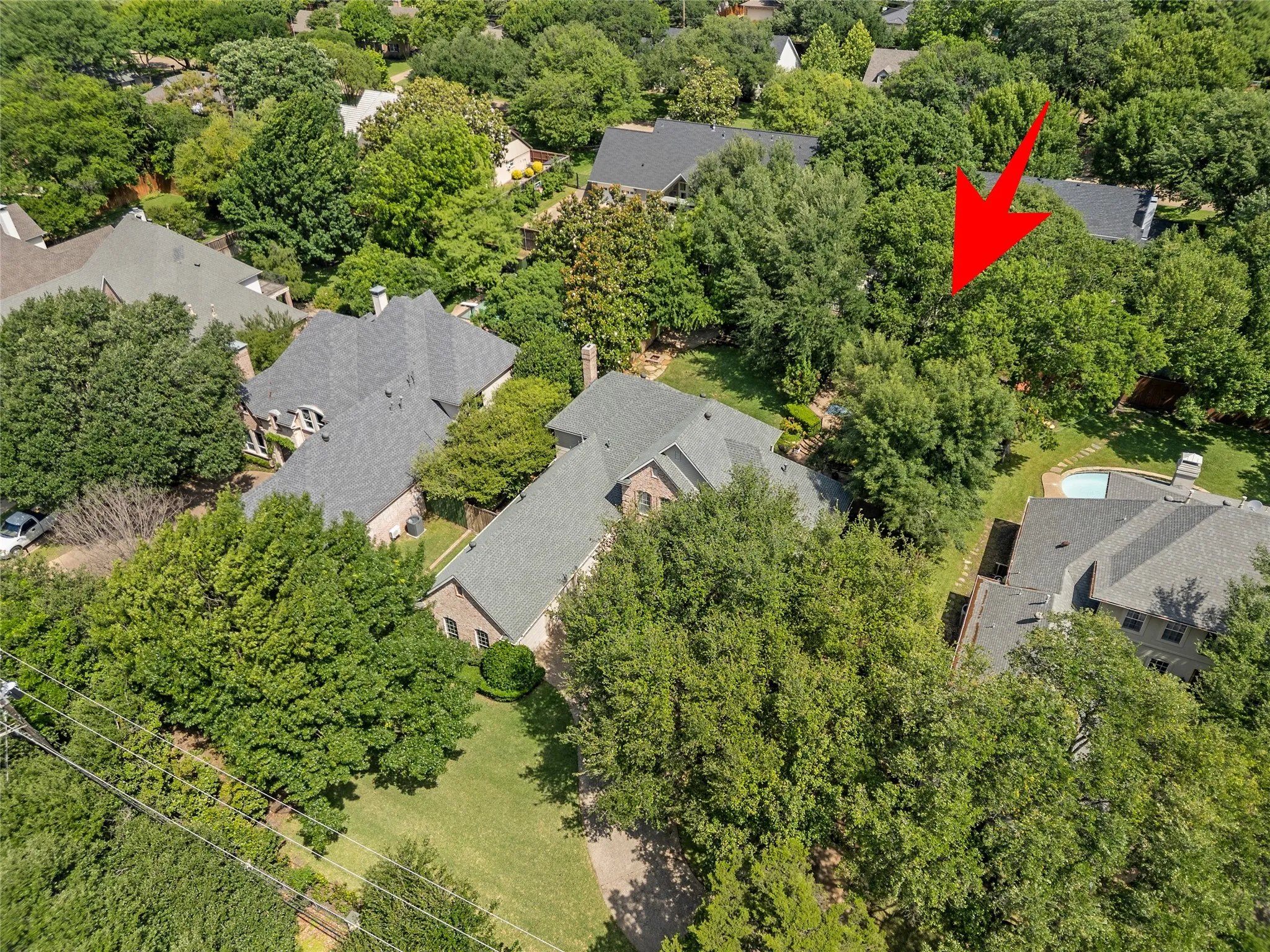 Perfectly positioned in one of Dallas’ most desirable and established neighborhoods, 4315 Northaven offers a rare combination of privacy, oversized lot space, and unbeatable convenience. Surrounded by mature trees and beautiful custom homes, this property feels like a peaceful retreat while remaining just minutes from the heart of the city.Situated near some of Dallas’ top private schools, including The Hockaday School, and close to major highways, shopping, dining, and entertainment, the location provides both luxury and everyday convenience. Just steps away, the nearby YMCA, sports fields, parks, and open green spaces create an active lifestyle that is hard to find in central Dallas.The oversized lot is a standout feature in the neighborhood, offering exceptional backyard space, mature landscaping, and a resort-style setting with pool, patio, and multiple outdoor entertaining areas. From the aerial views, you can truly appreciate the privacy created by the lush tree canopy and the expansive lot size