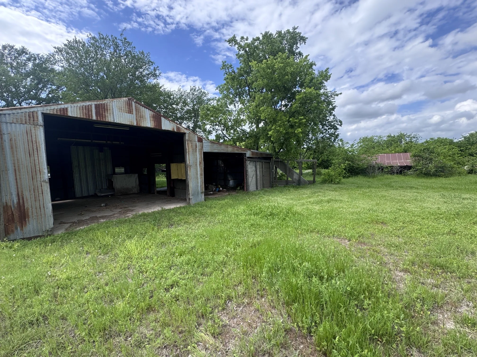 Two-bay metal outbuilding with a corrugated roof