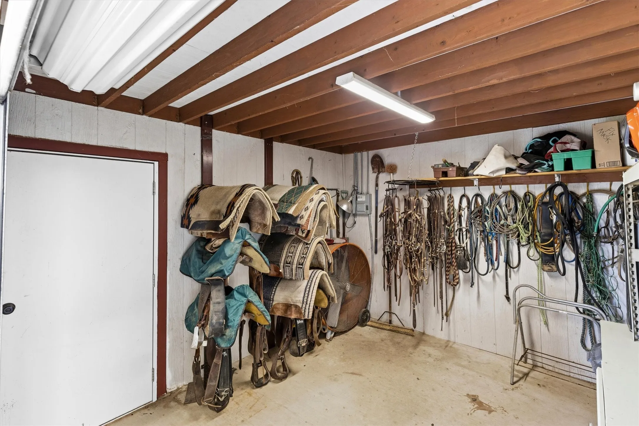 Tack room with large roll up door