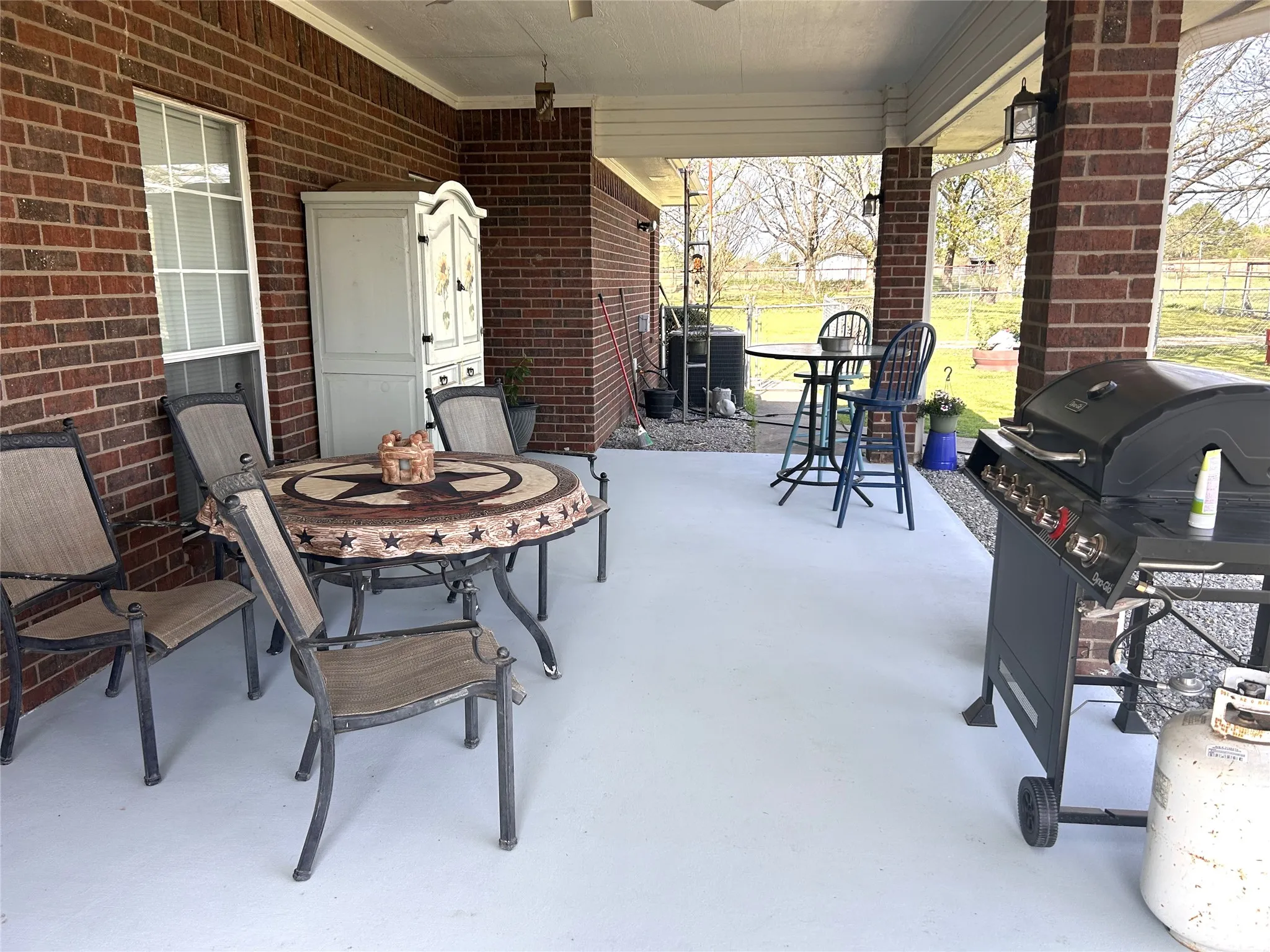 Concrete covered patio with lights and fan