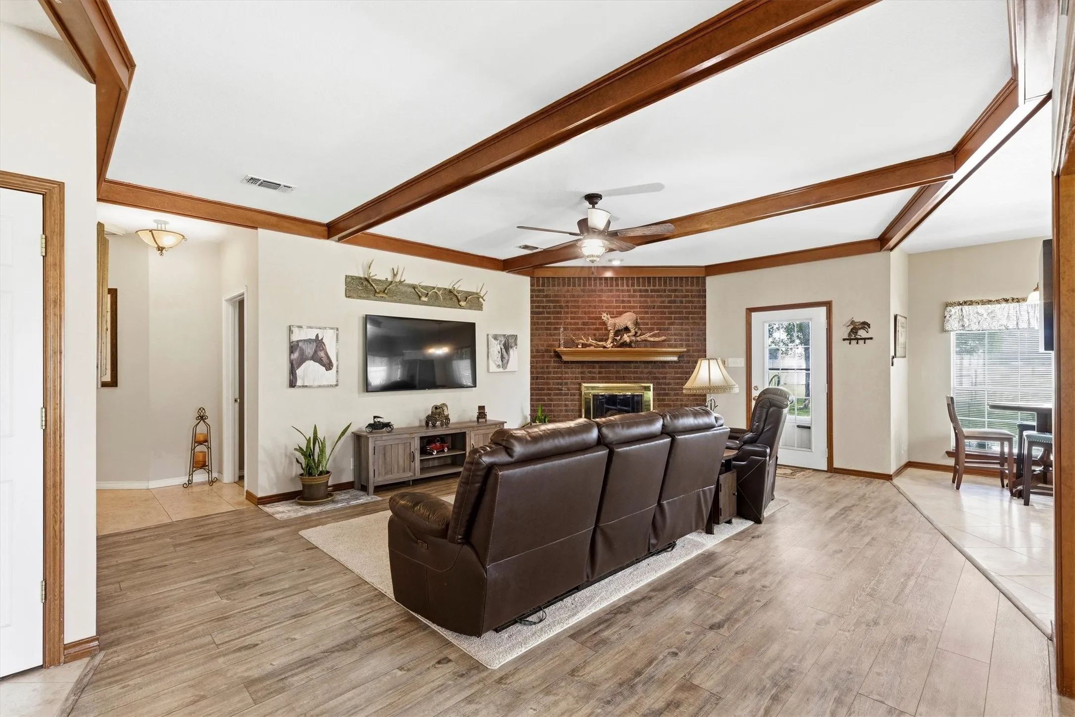 Living room - wood beam ceilings - fireplace