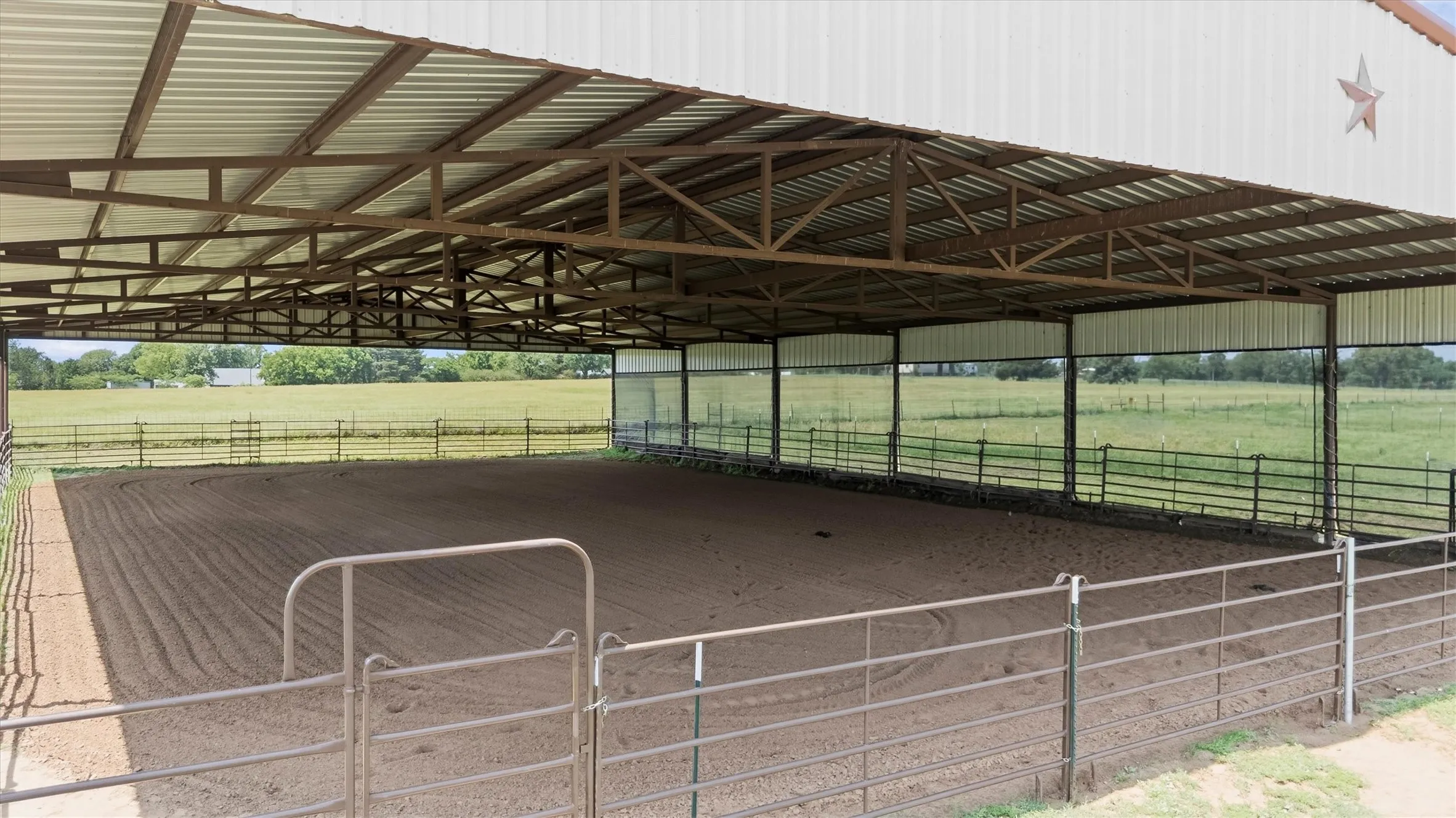 Covered riding arena
screens on one side