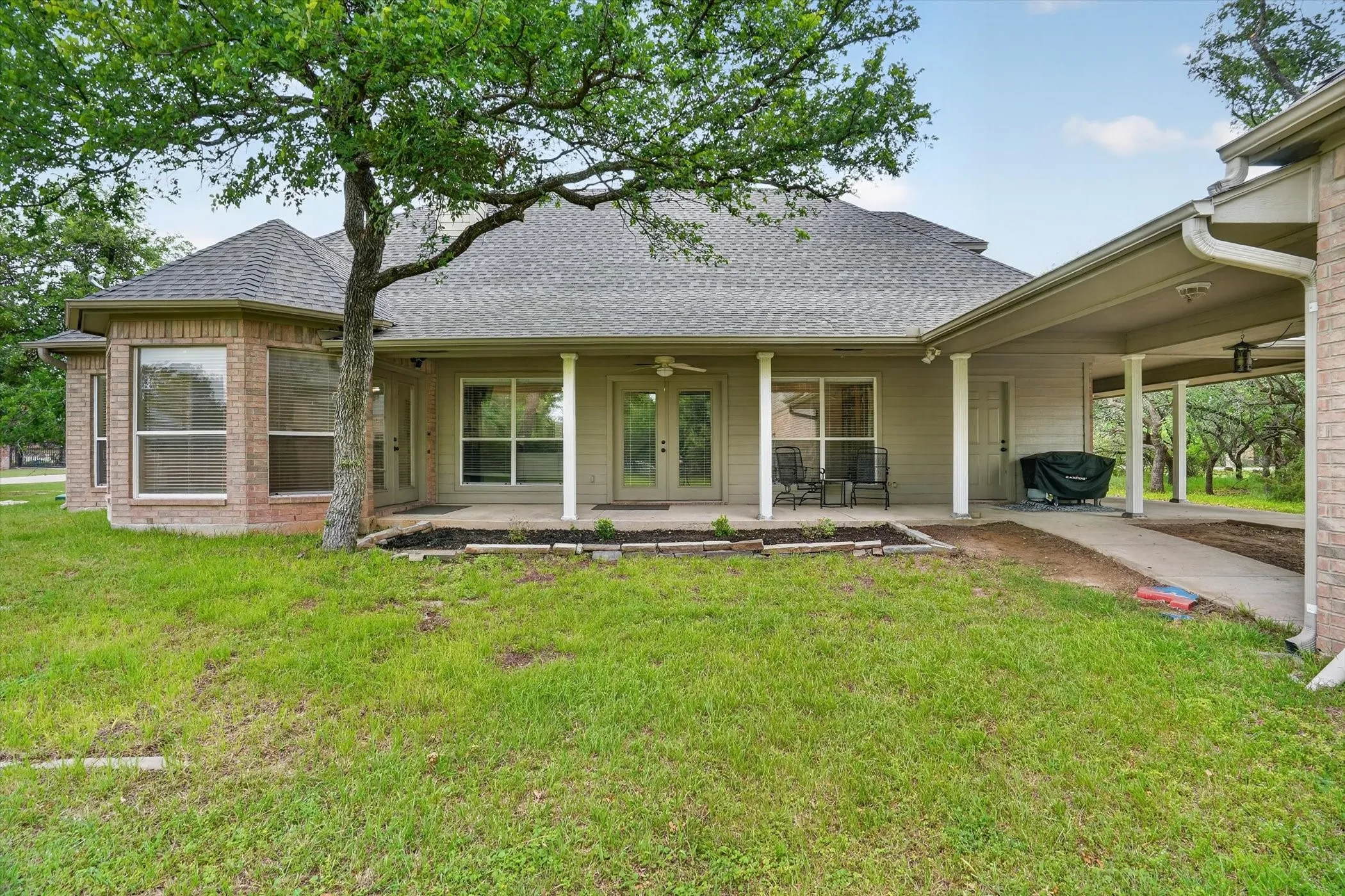 View of the back yard with large yard