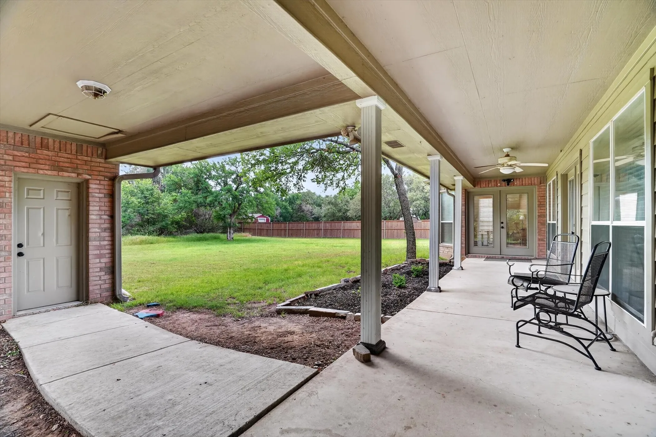 Covered porch and porteche that leads to the garage and unfinished bonus room