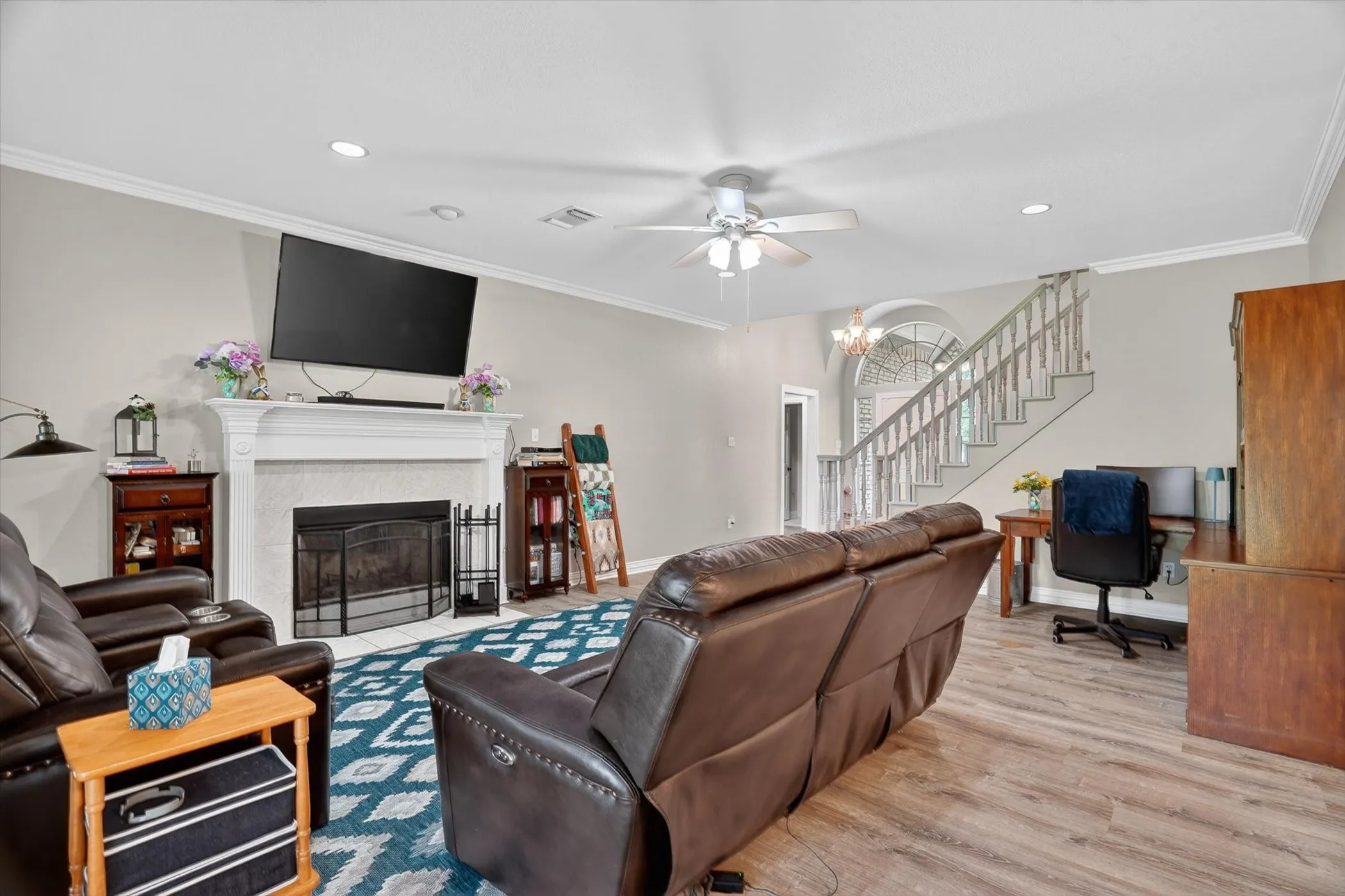 Large living area with wood burning fireplace as the center point of the room