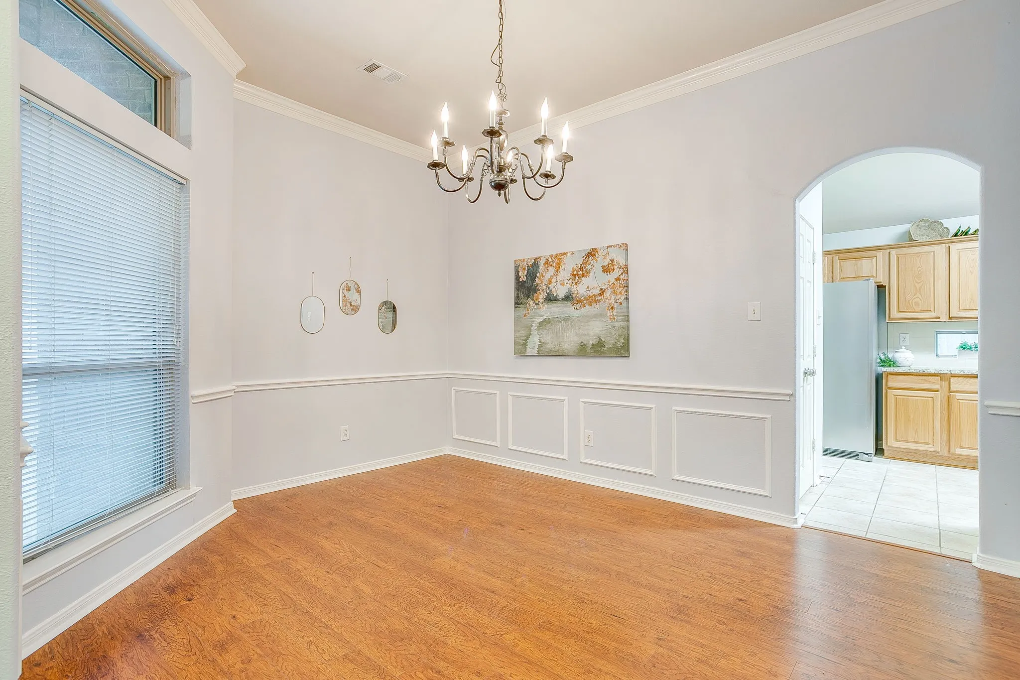 Tall ceilings, crown molding, and charming formal room.