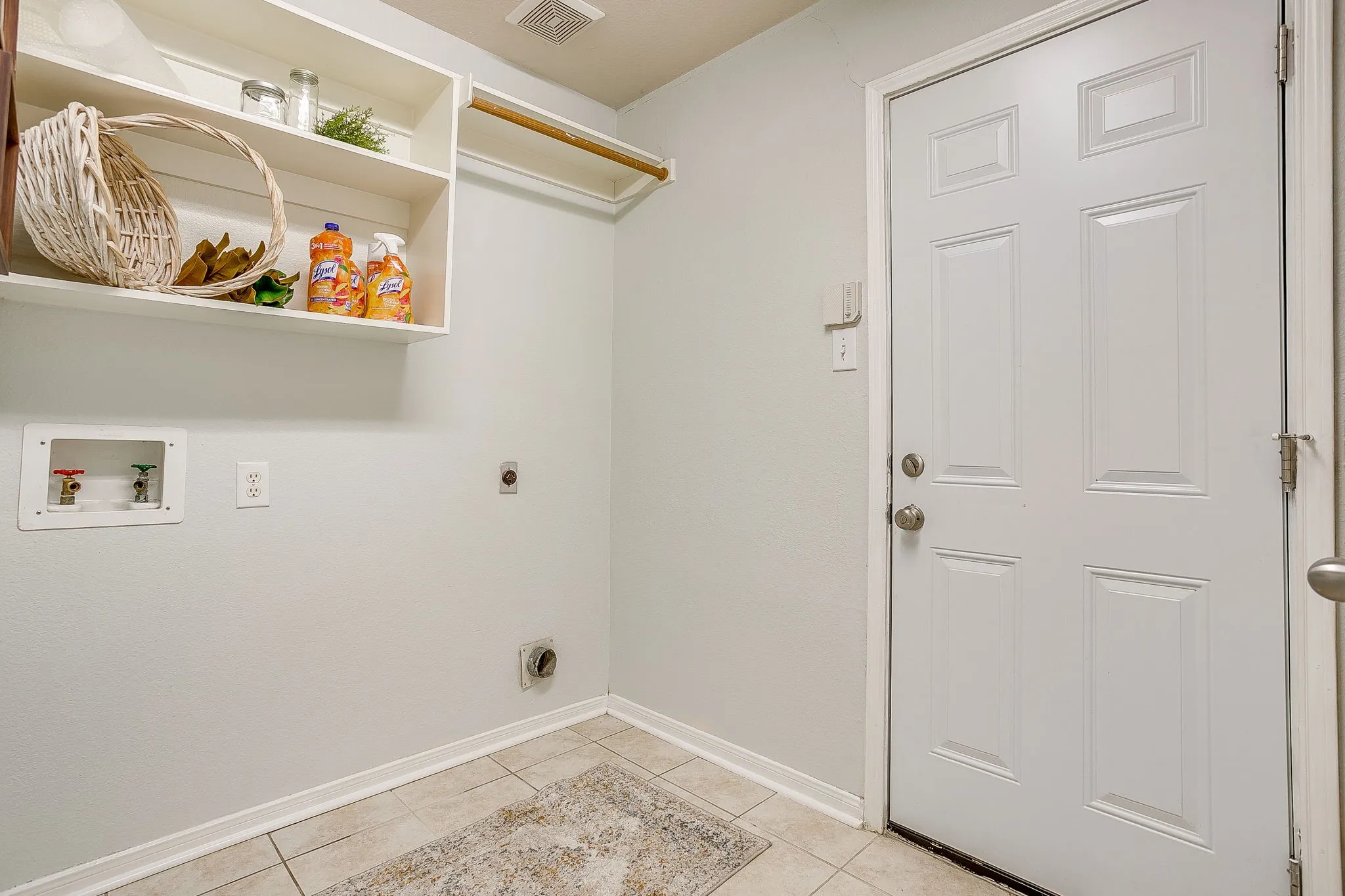 Spacious utility room with room for freezer or extra fridge and second pantry