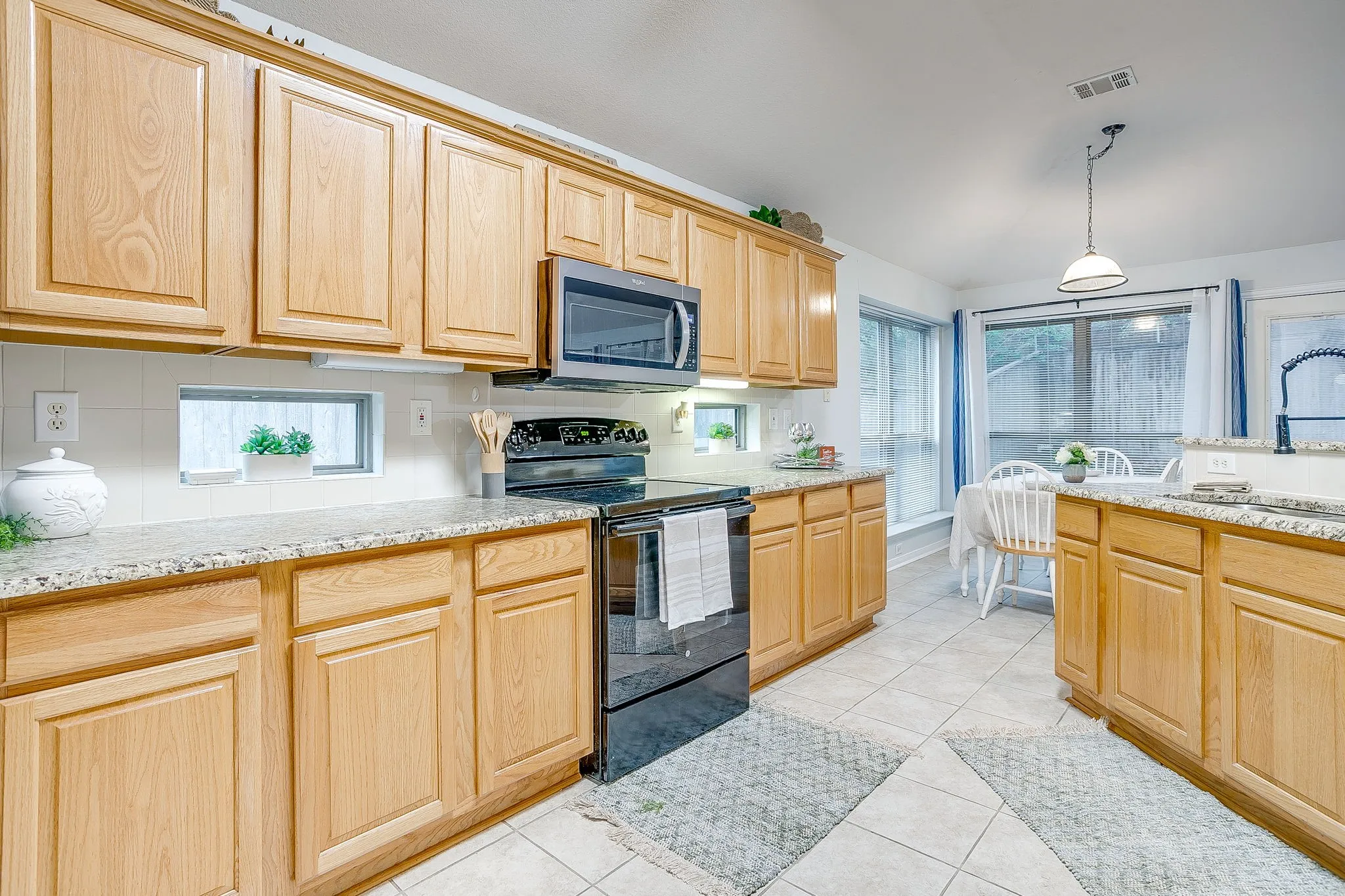 Lots of windows, elevated granite counter tops, new microwave and dishwasher