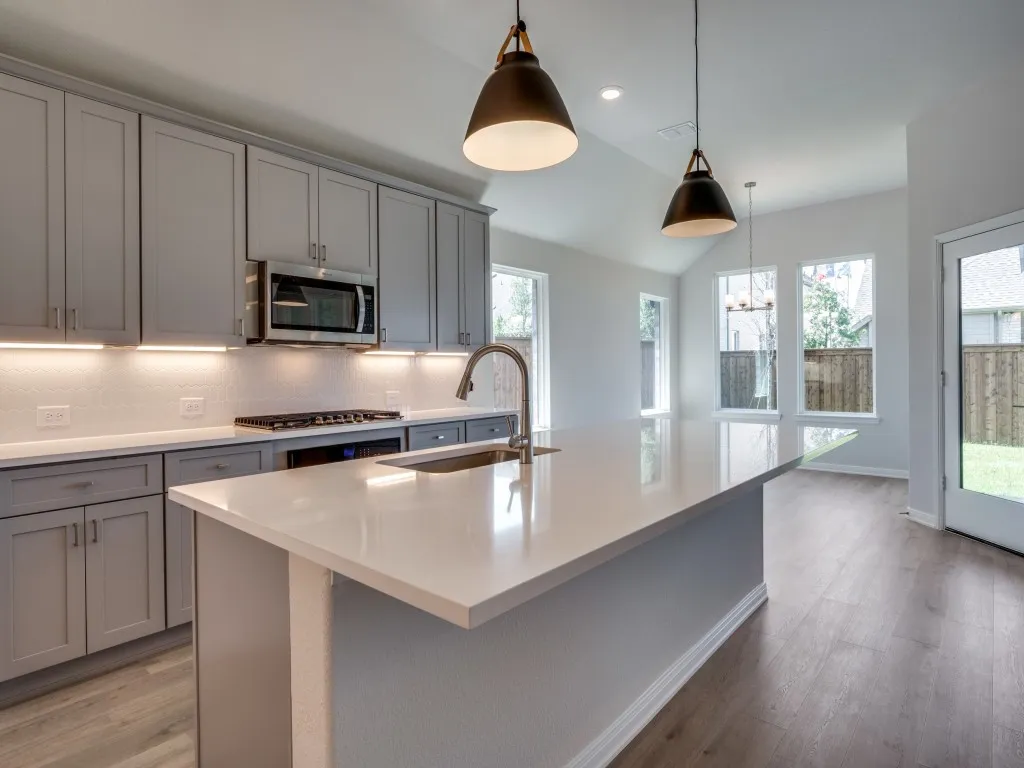 Beautiful cabinetry and gorgeous countertops paired with stainless appliances make this a kitchen any chef would be proud to call their own!