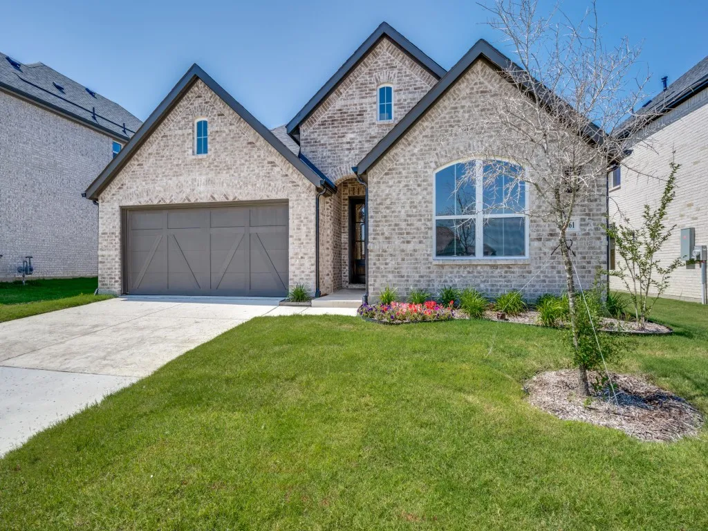 Beautiful brick, striking trim and wonderful architectural details create fantastic curb appeal in this dream home!