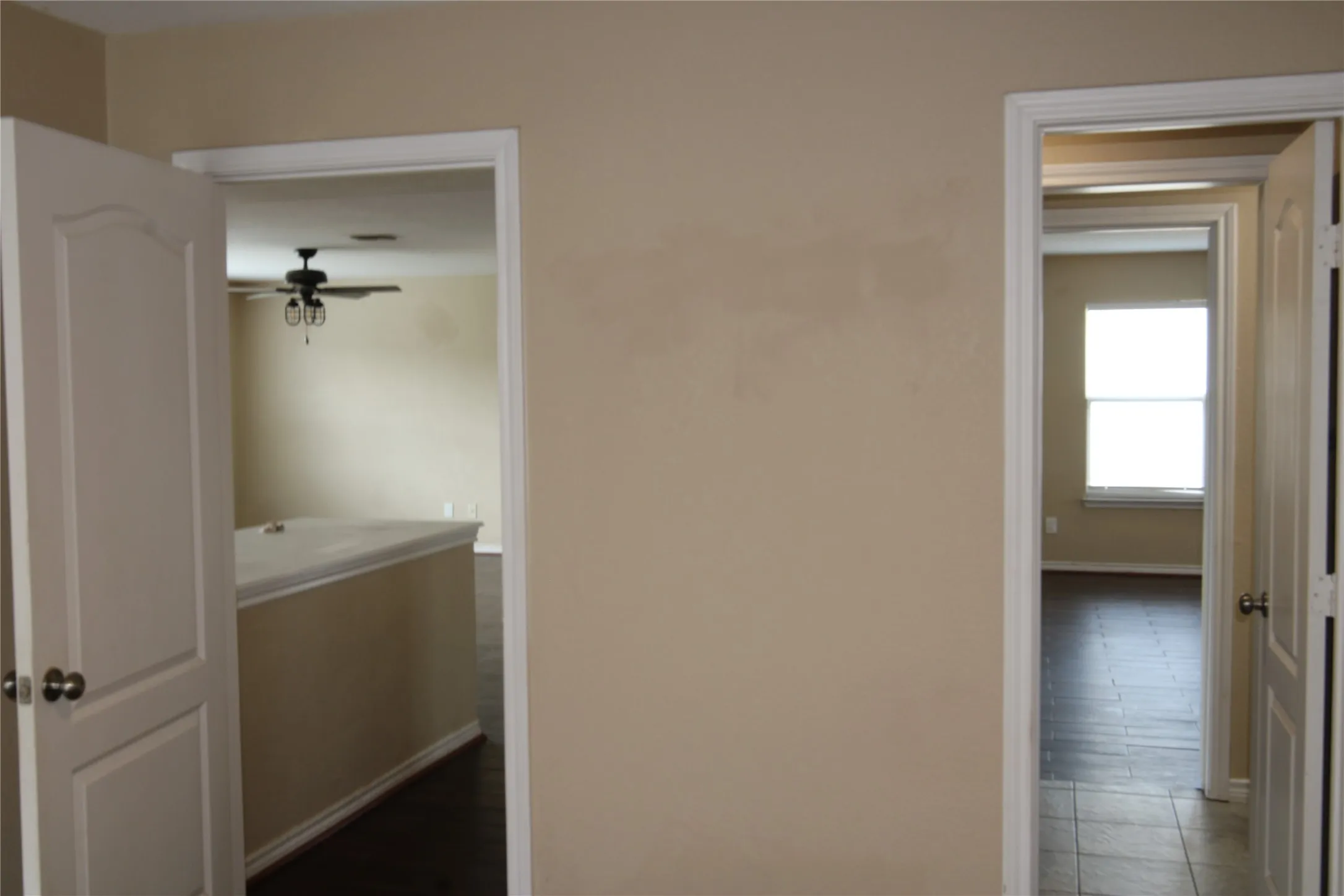 Downstairs bedroom looking into living area and bath