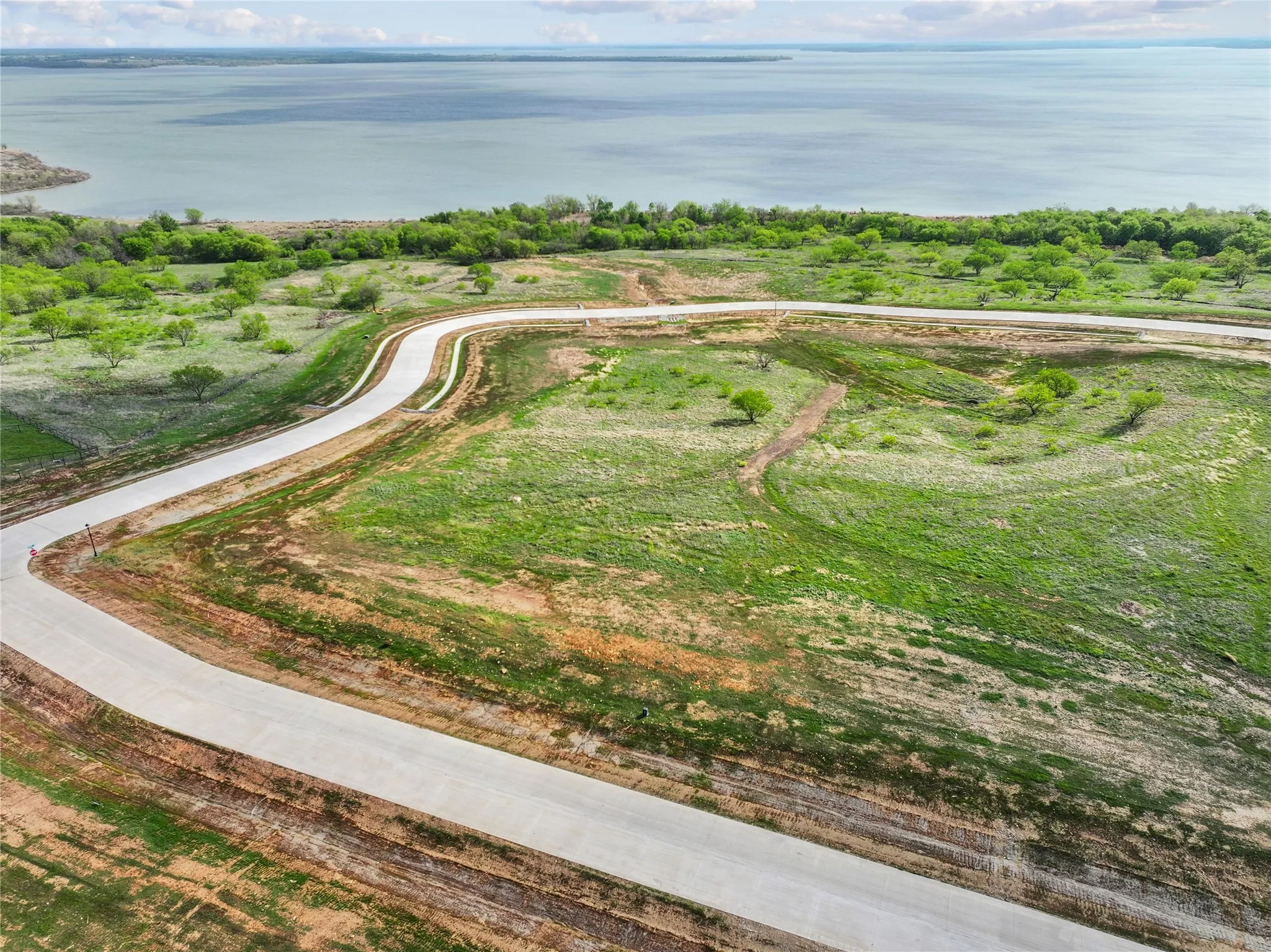 Expansive waterfront land parcel featuring direct water frontage and established roadways