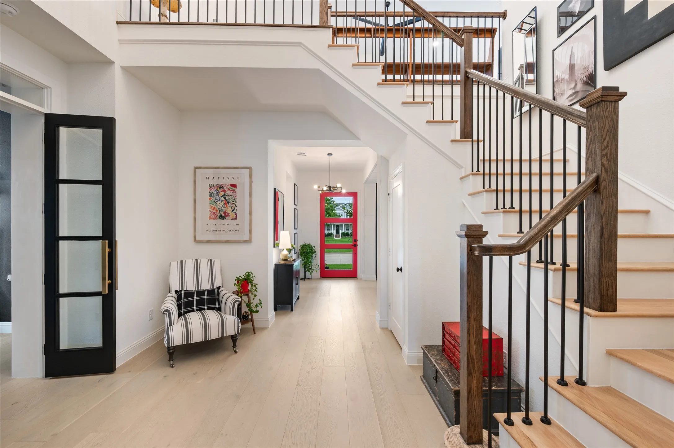 Entry right off the font of home, with custom staircase, flooring, paint and more!