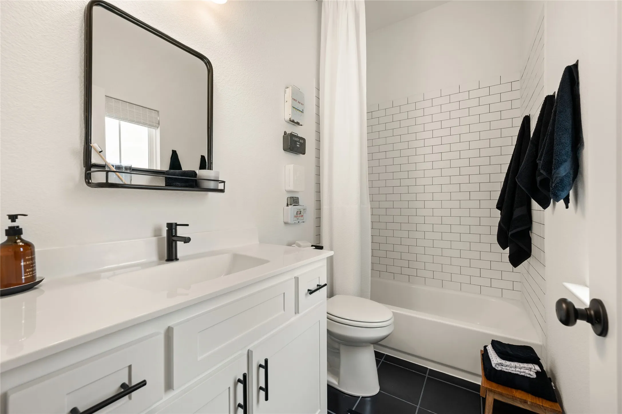 Ensuite bathroom to second level bedroom with upgraded mirror and hardware