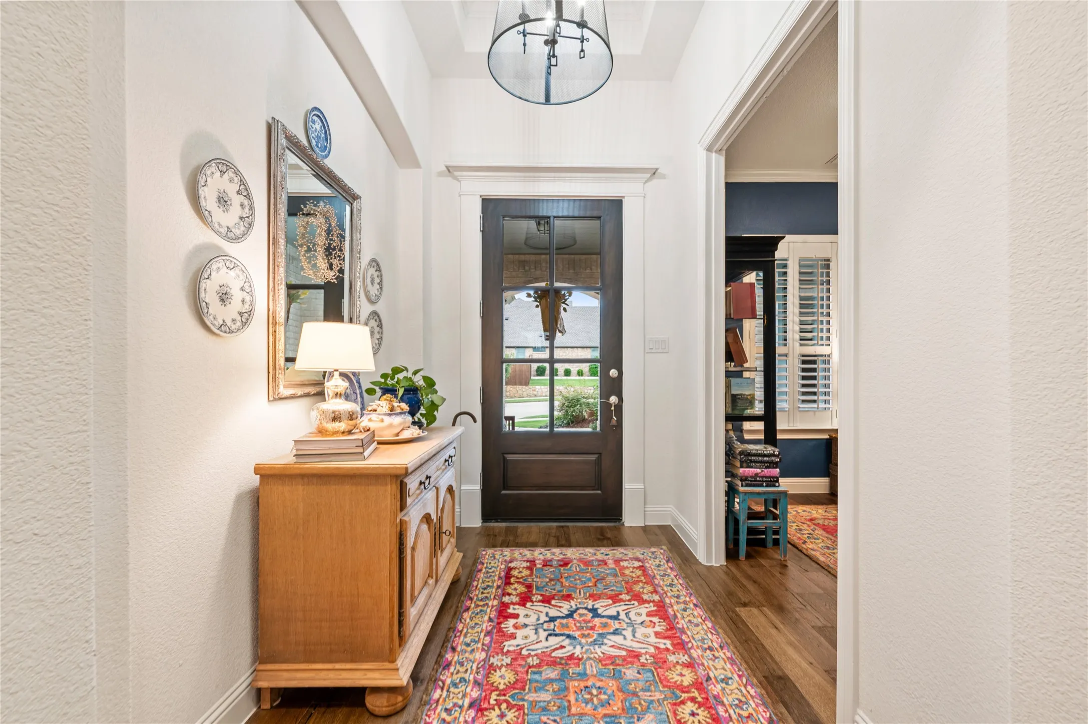 Gorgeous front entry with office off the foyer, wood flooring, updated fixtures, custom paint and more