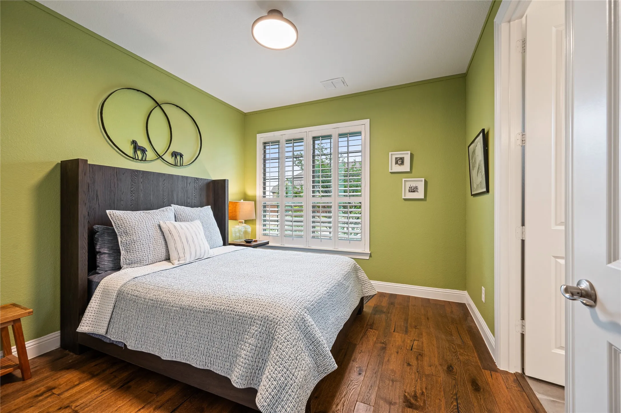 Bedroom off the gen suite with custom closet and built in spaces.