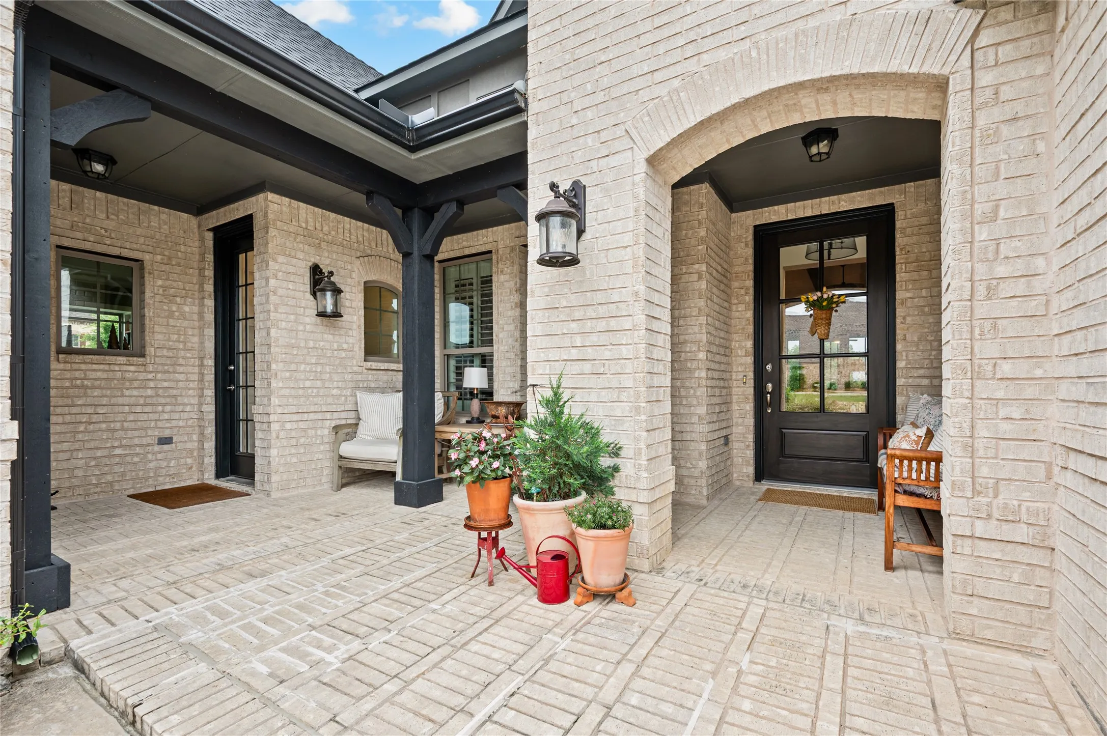 Arched brick entryway featuring a private courtyard and secondary entry to generation suite