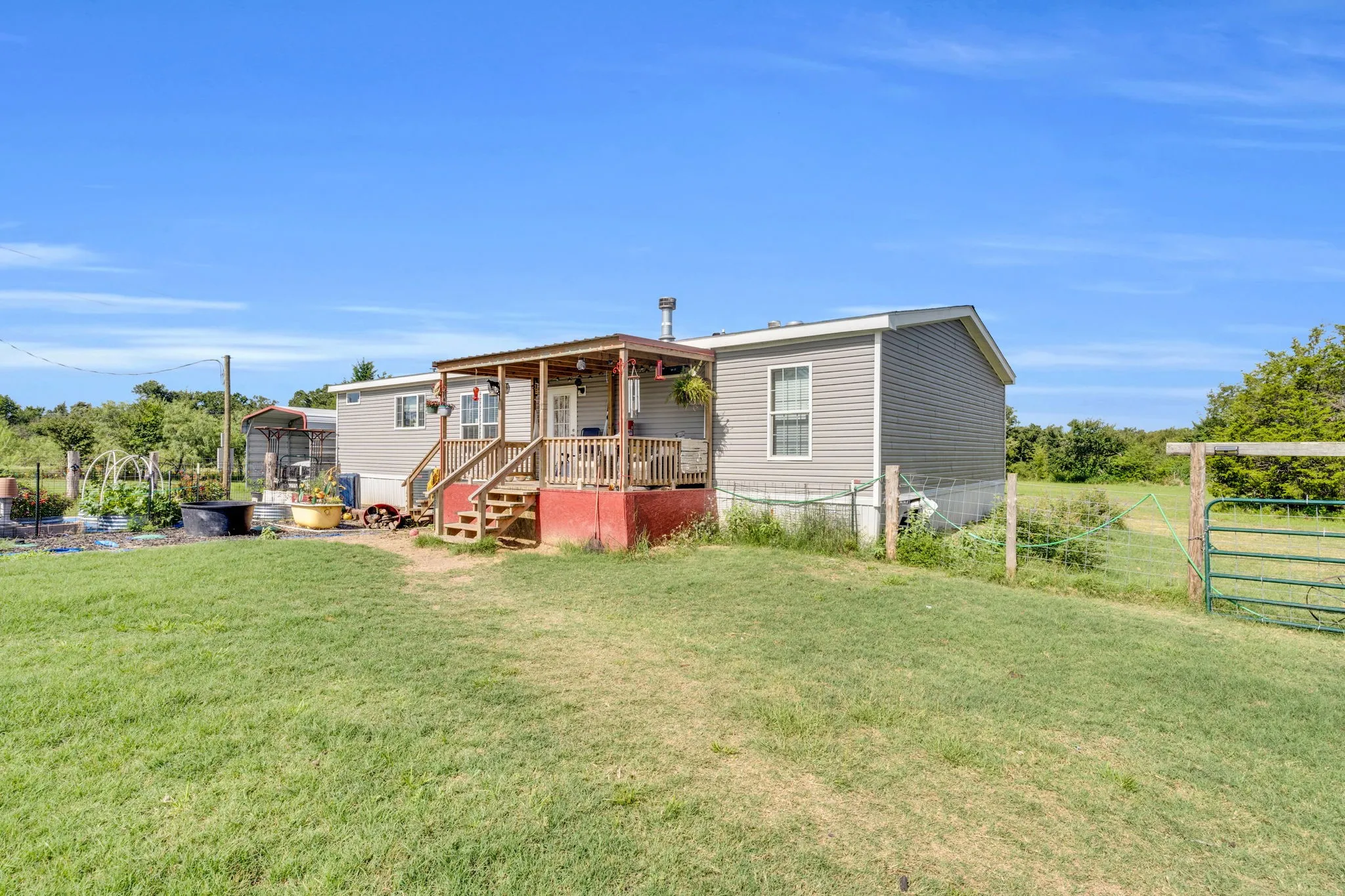 Back view of home with deck.